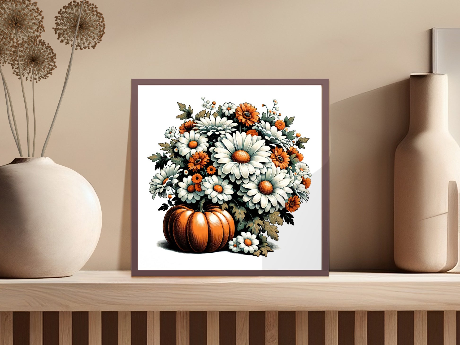 Framed artwork of a pumpkin with flowers on a shelf against a beige wall.