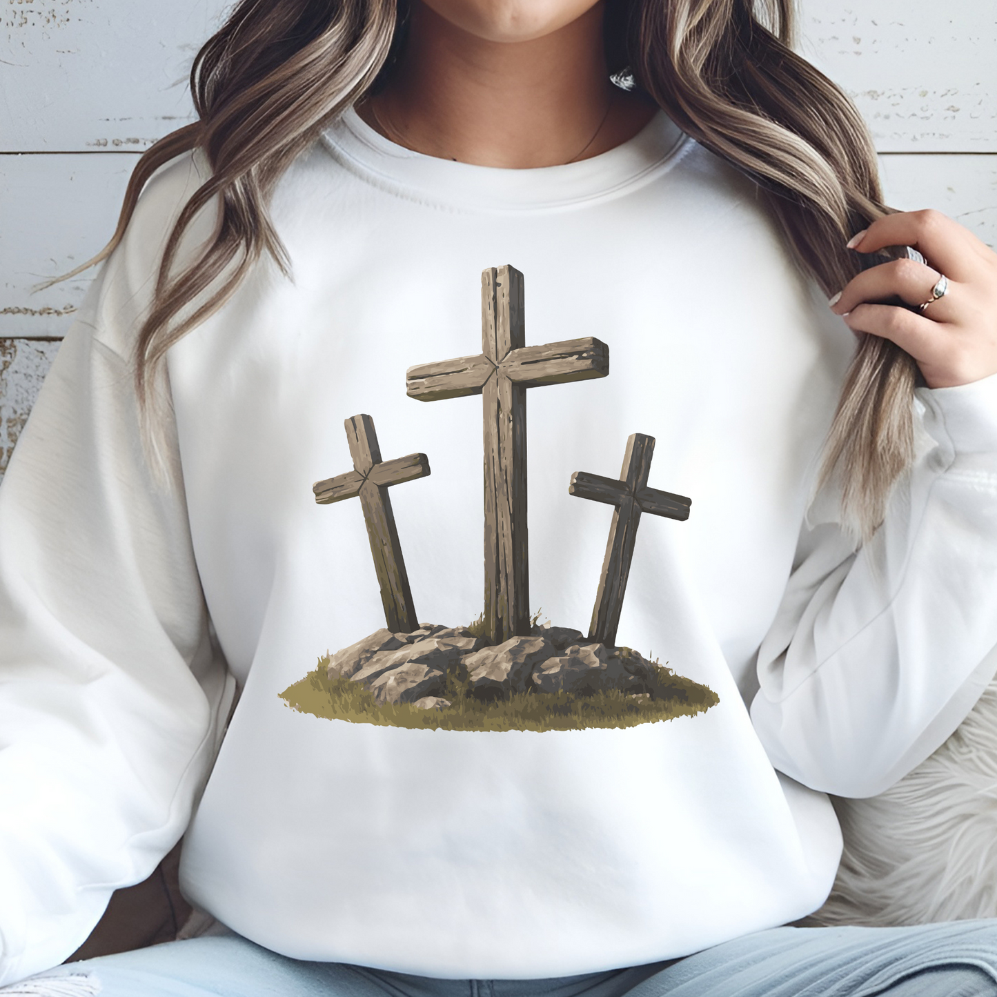 3 Rugged Crosses digital design on a woman's white sweatshirt