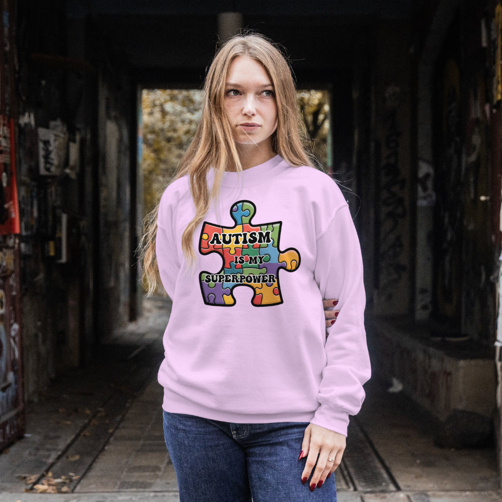 Autism Is My Superpower digital design on a woman’s pink sweatshirt