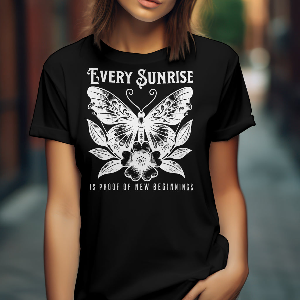Every Sunrise Is Proof Of New Beginnings digital design on a black t-shirt
