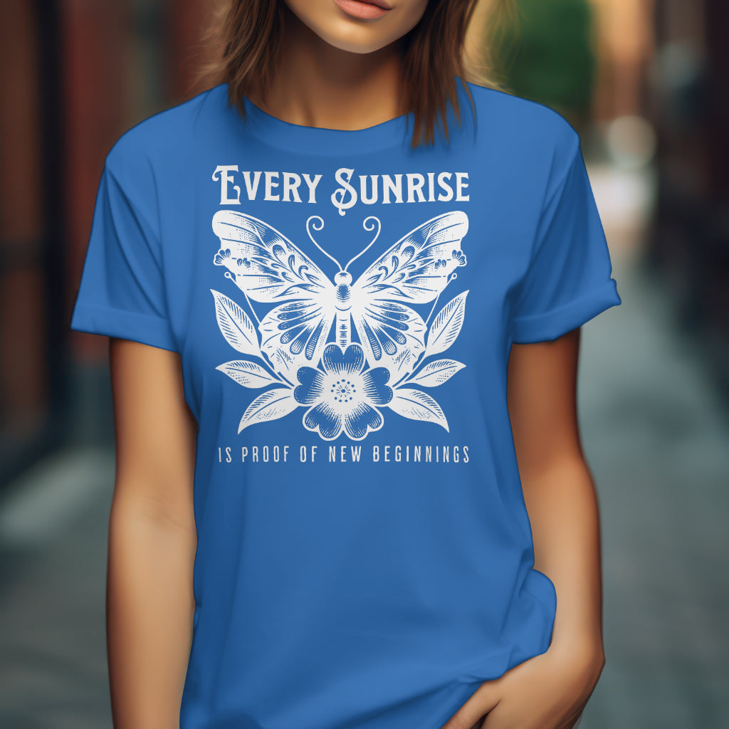 Every Sunrise Is Proof Of New Beginnings digital design on a blue t-shirt
