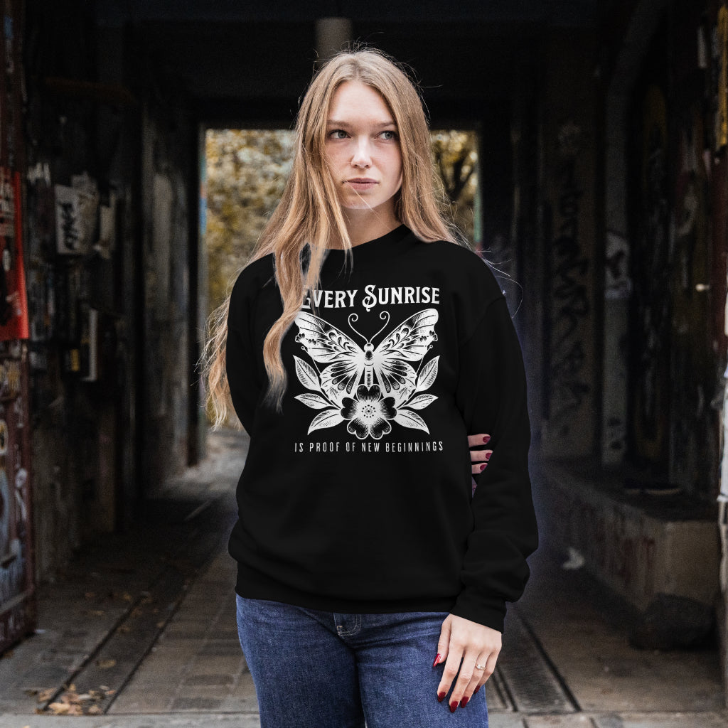 Every Sunrise Is Proof Of New Beginnings digital design on a black sweatshirt
