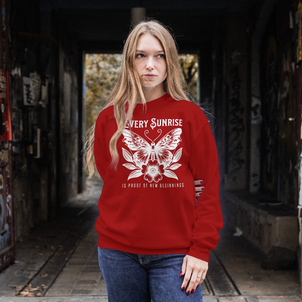 Every Sunrise Is Proof Of New Beginnings digital design on a red sweatshirt