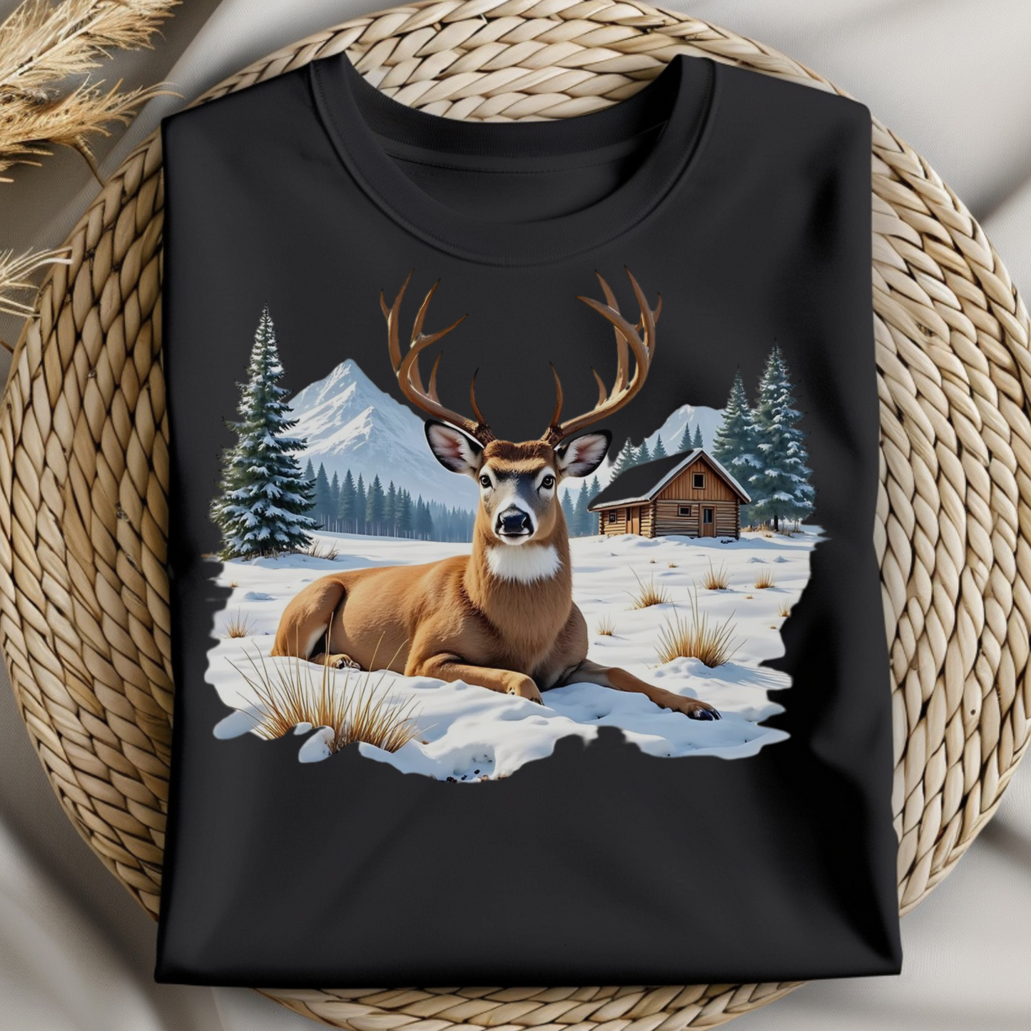 Deer On The Snow PNG digital design on a folded black t-shirt.