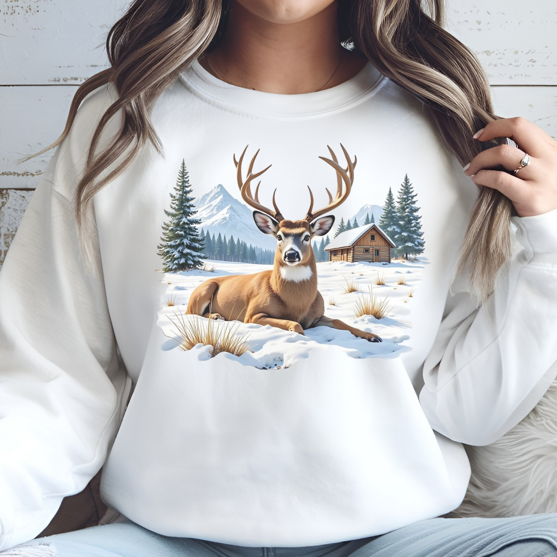 Deer On The Snow PNG digital design on a woman's white sweatshirt.