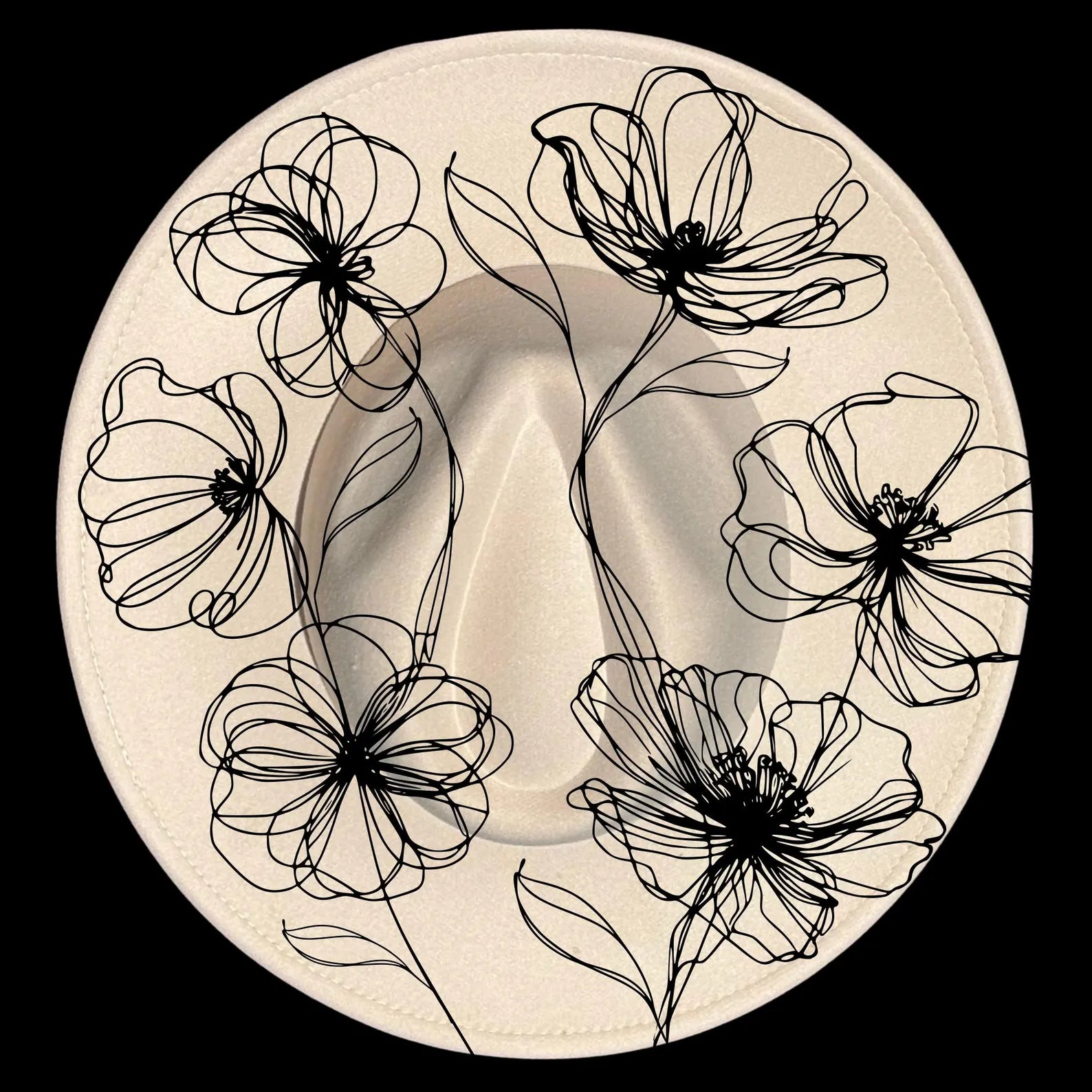 Decorative hat burning design with black poppies designs on a beige wide brim hat