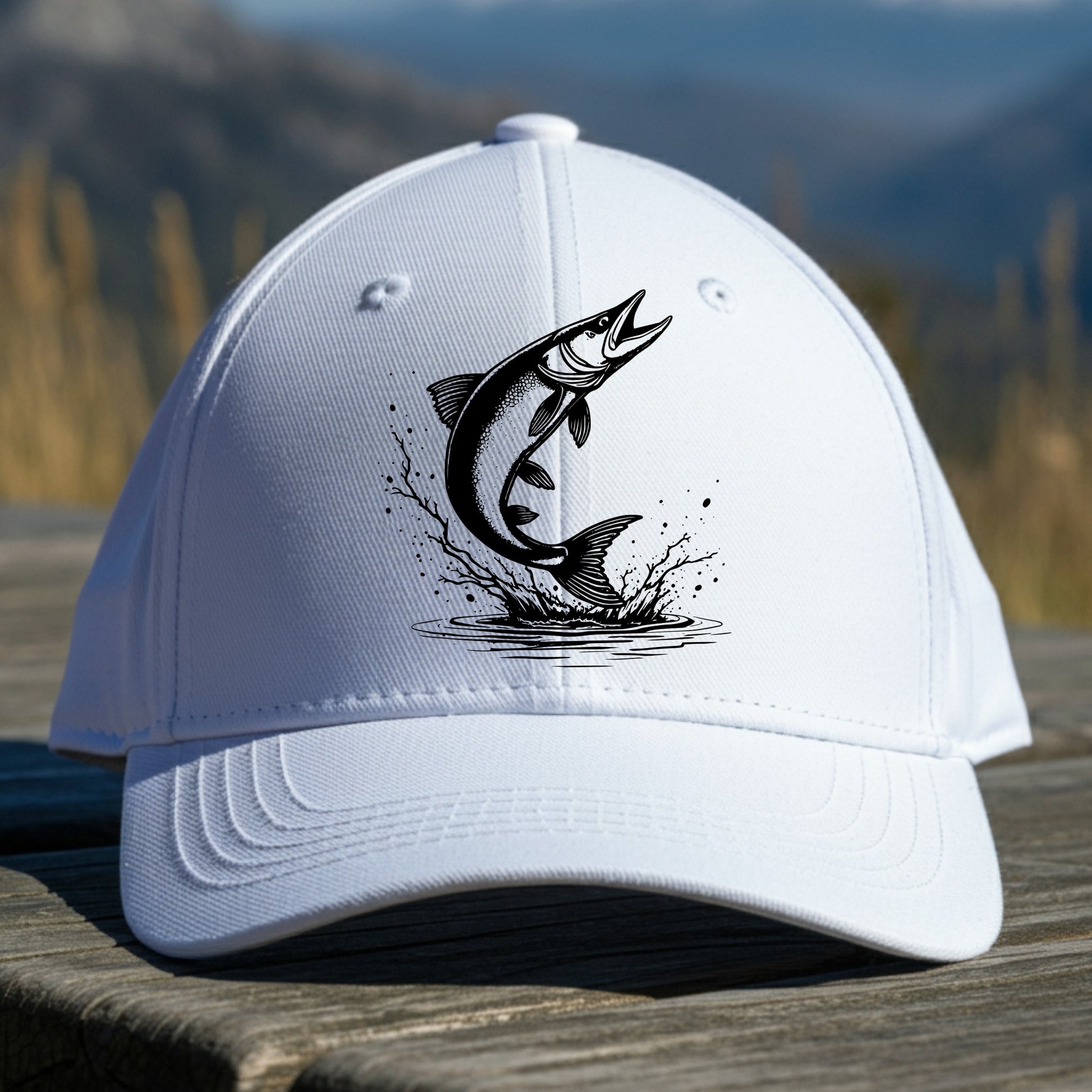 White cap with black muskie fish design on a wooden surface with a natural background