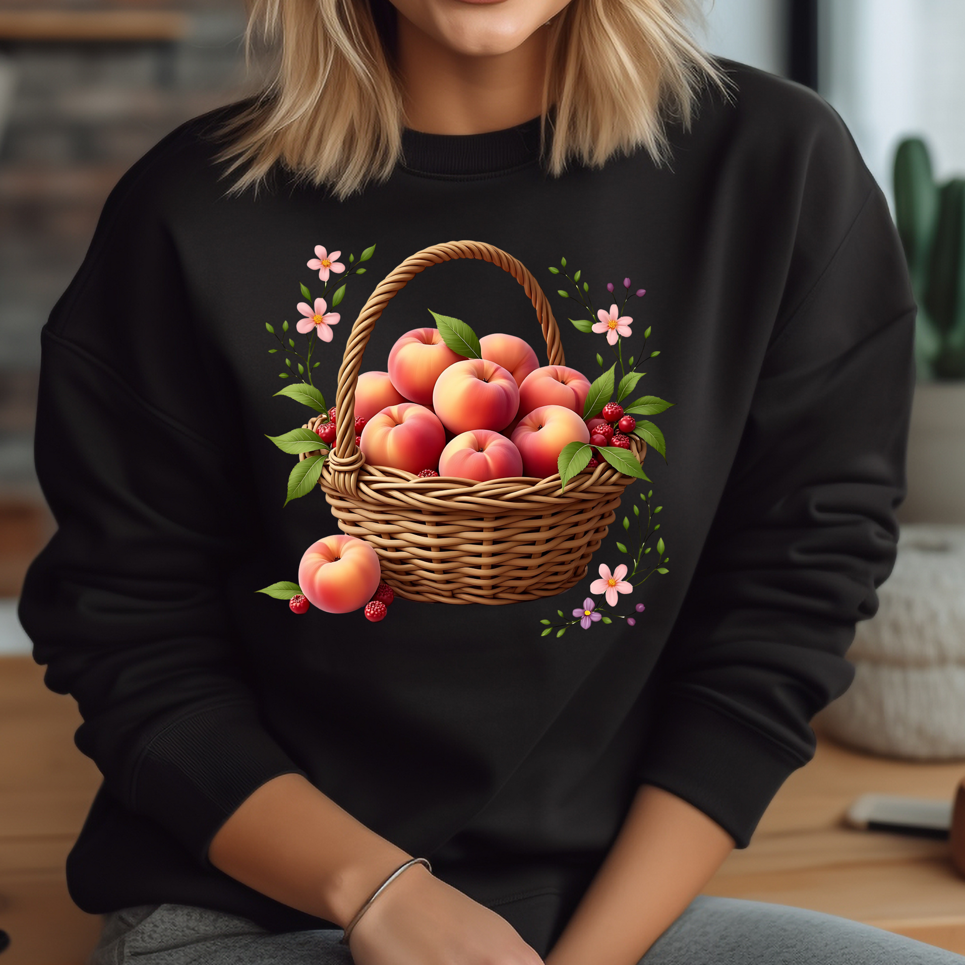 Basket Of Peaches PNG digital design on a woman's black sweatshirt