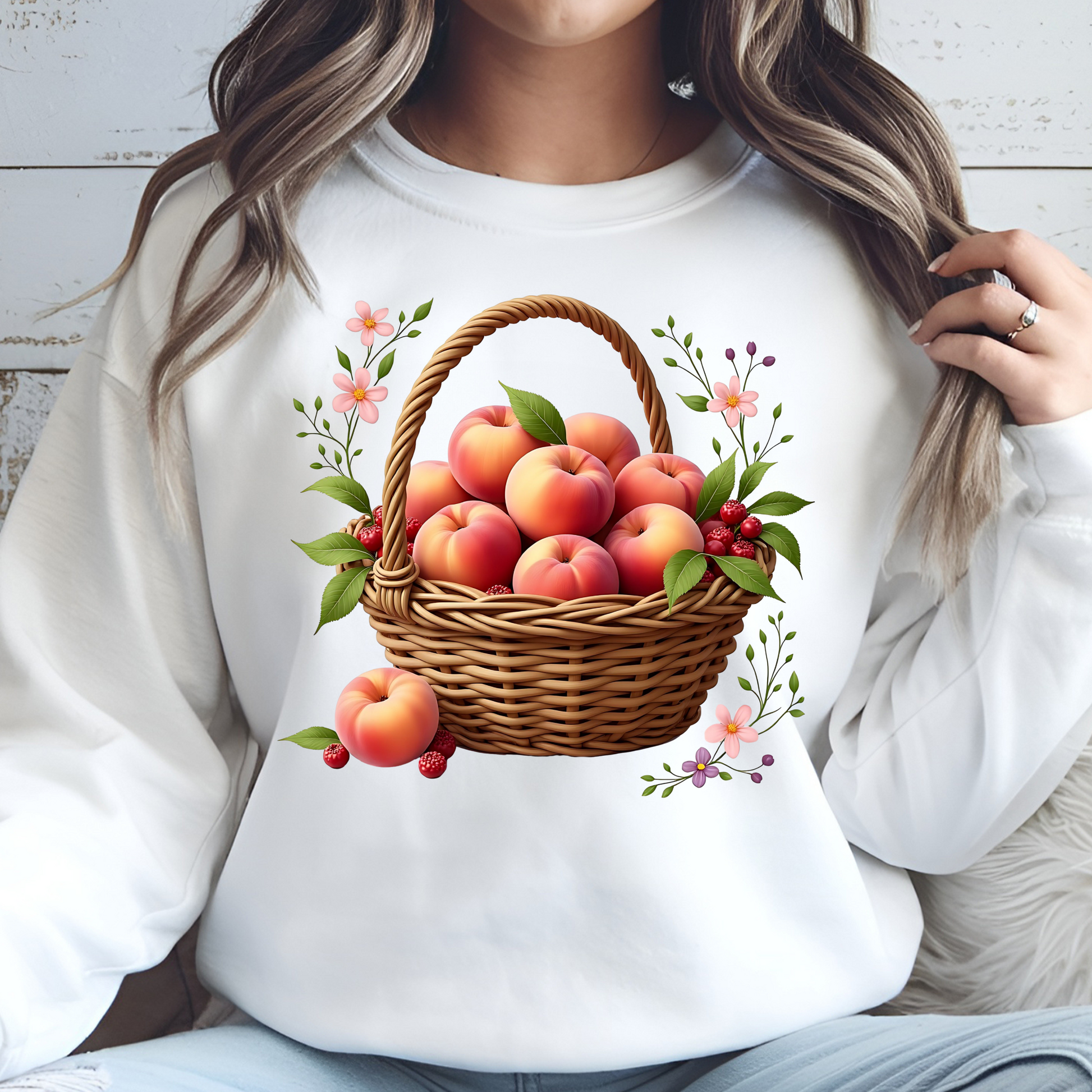 Basket Of Peaches PNG digital design on a woman's white sweatshirt