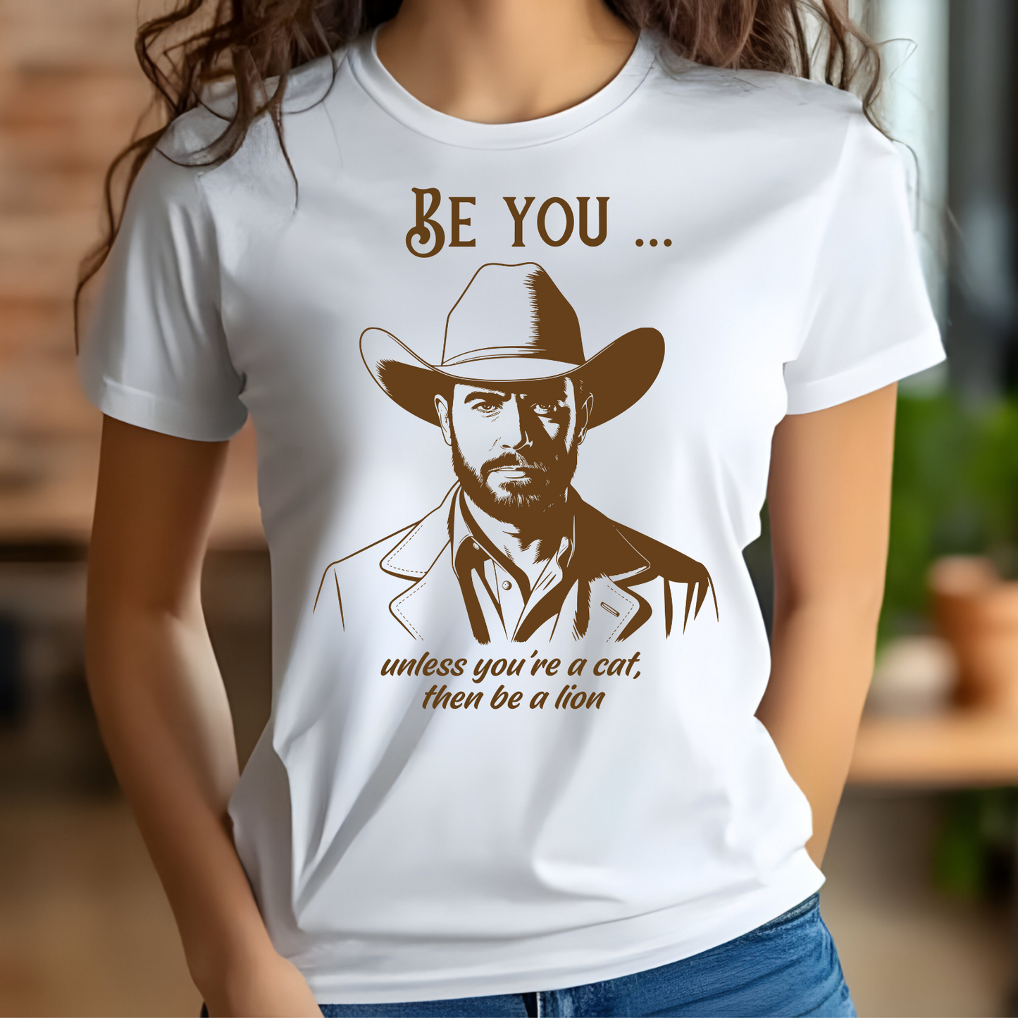 Be You Unless You’re A Cat, Then Be A Lion digital download on a woman’s t-shirt