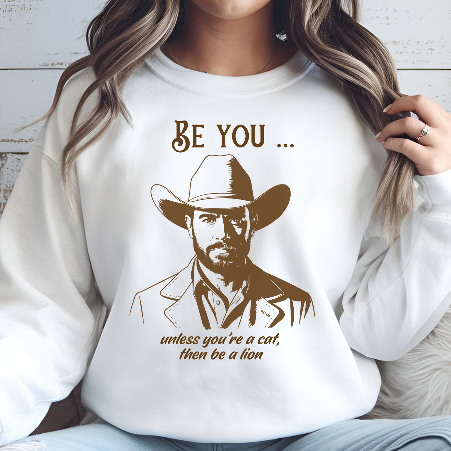 Be You Unless You’re A Cat, Then Be A Lion digital download on a sweatshirt