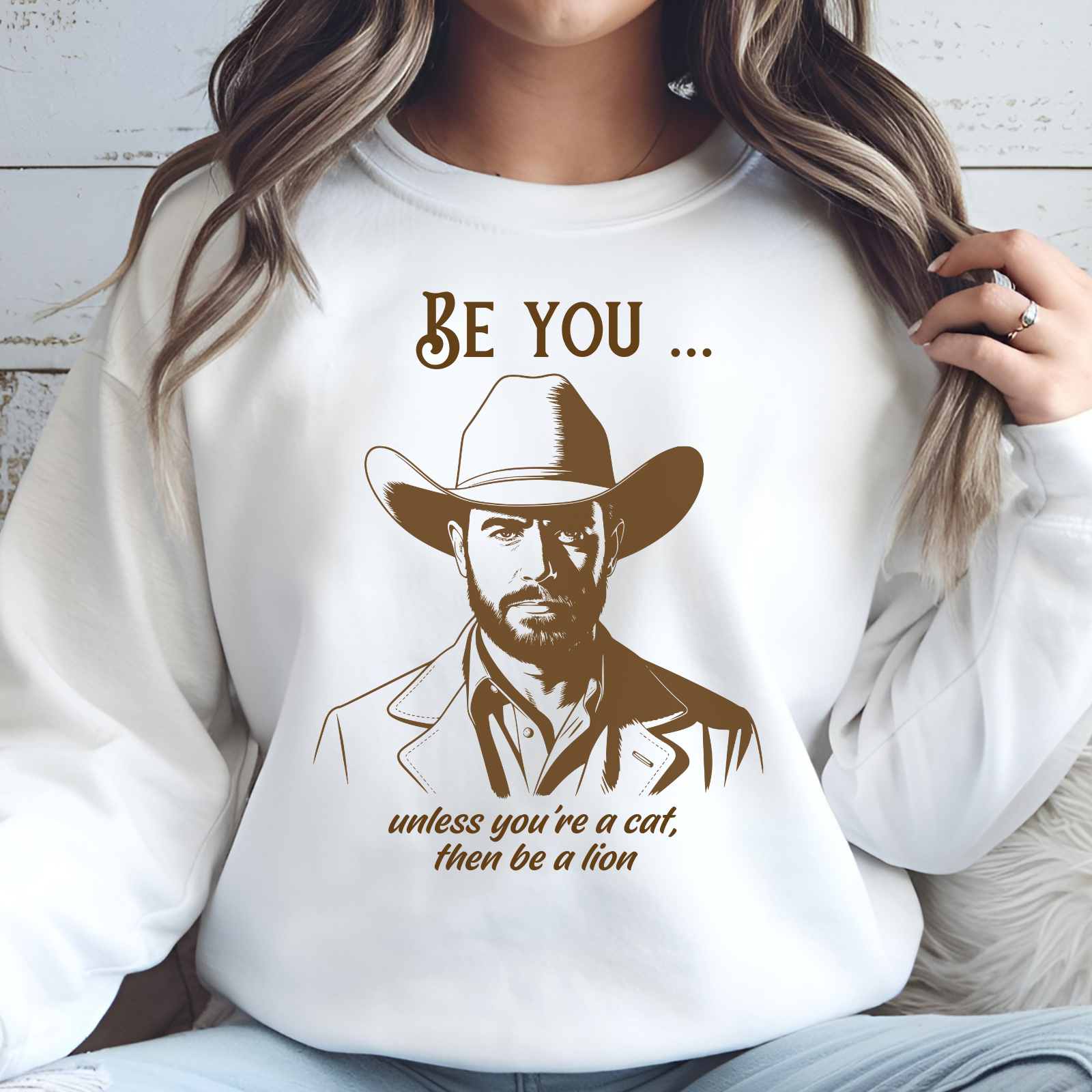 Be You Unless You’re A Cat, Then Be A Lion digital download on a sweatshirt