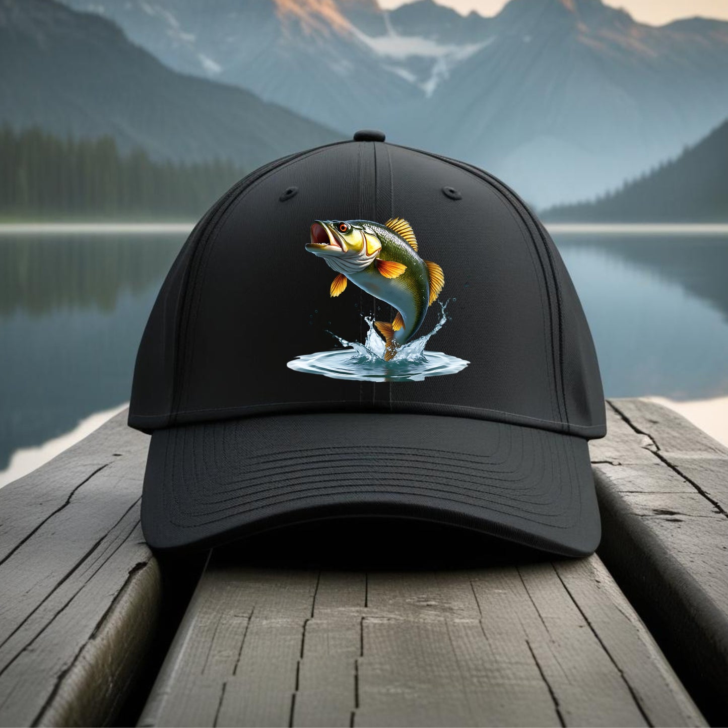 Black cap with a fish design on a wooden dock with a mountain and lake background