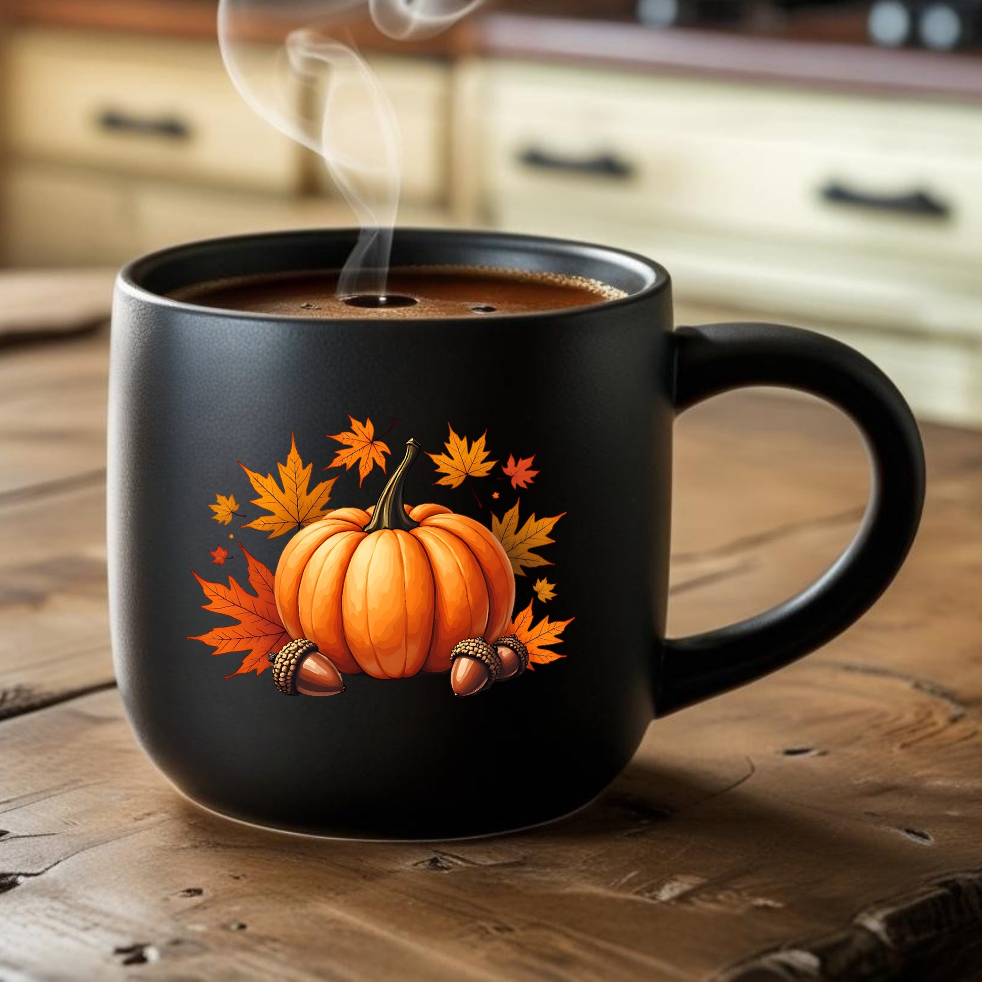 Black mug with pumpkin and leaf design on a wooden table
