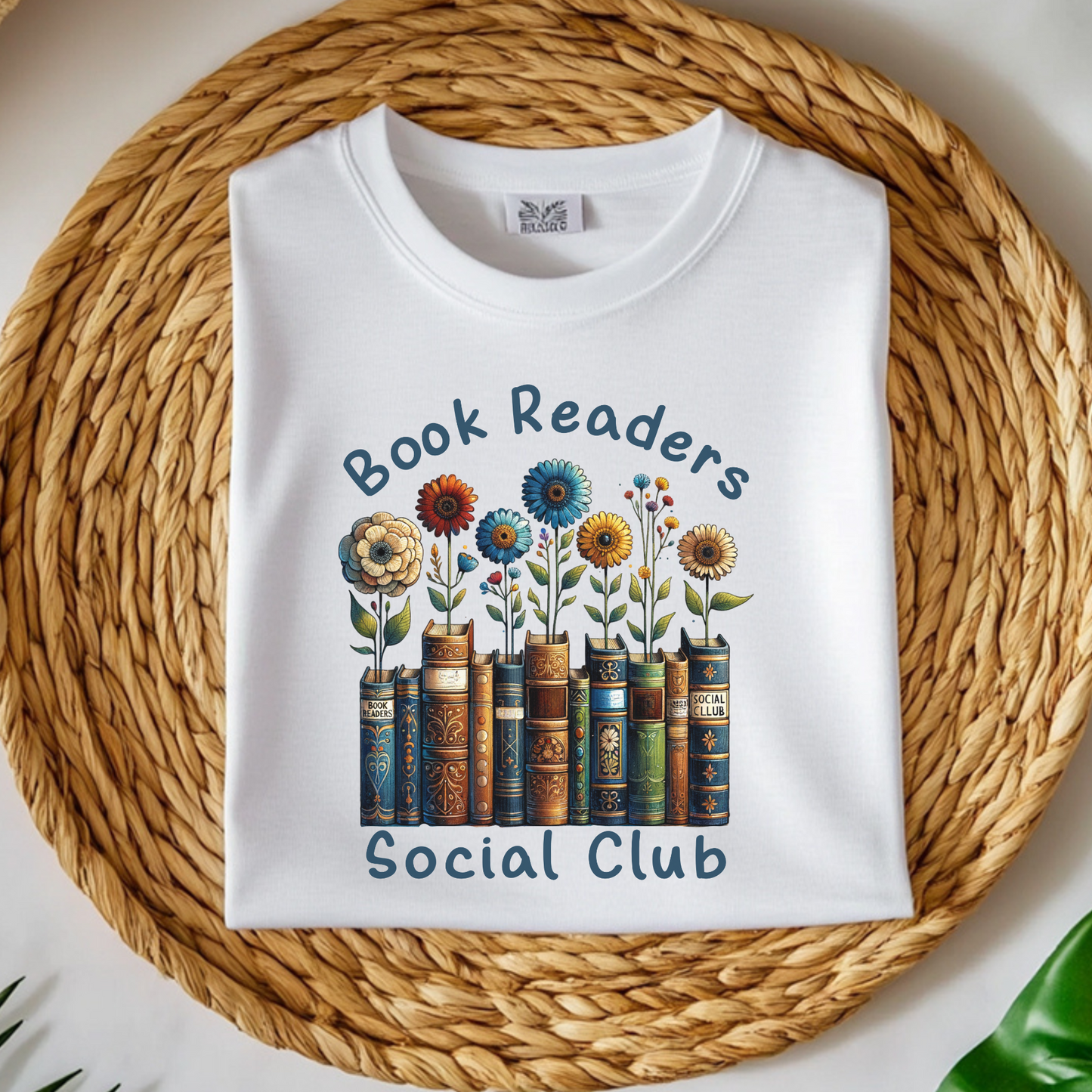 Book Readers Social Club PNG digital design on a folded t-shirt