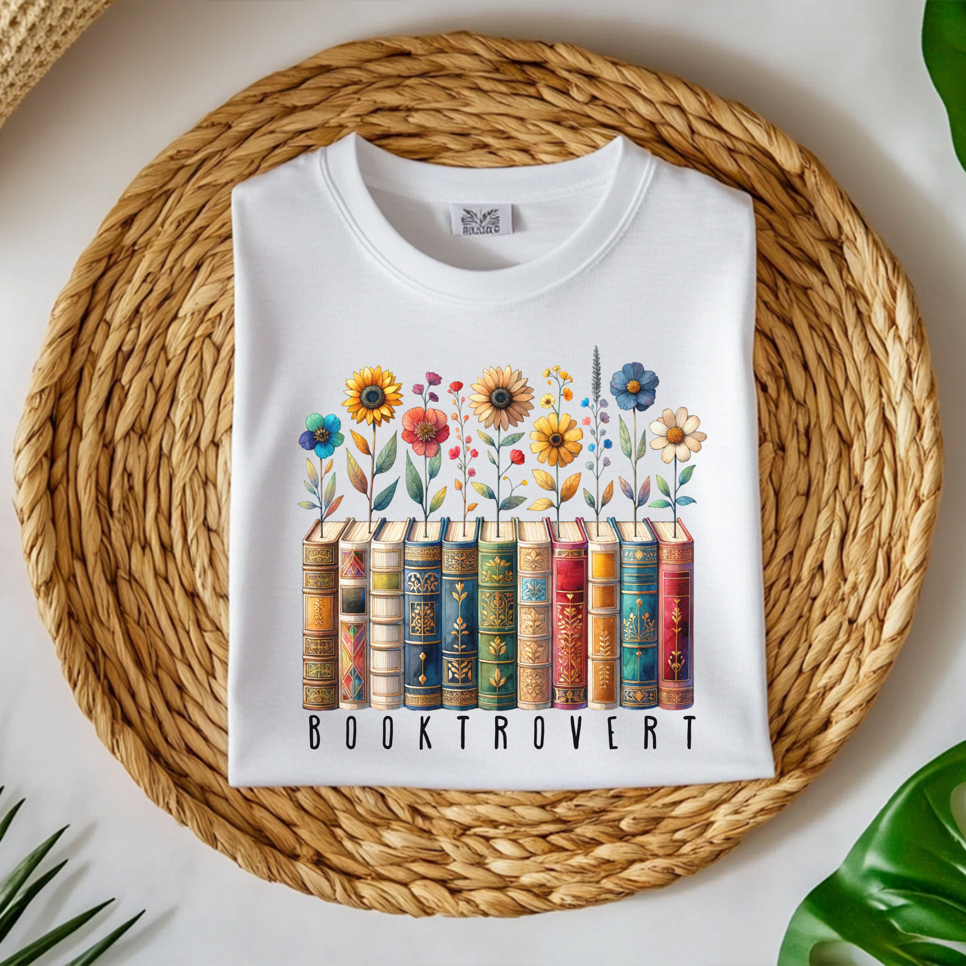 Booktrovert Book Lover PNG Digital Design on a folded t-shirt