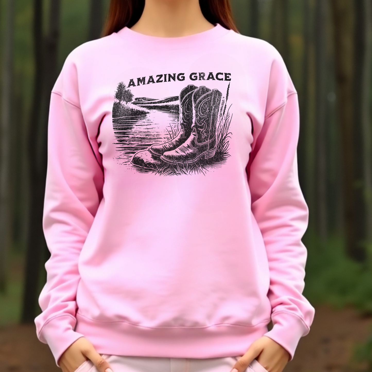 River Boots Amazing Grace digital design on a woman’s pink sweatshirt