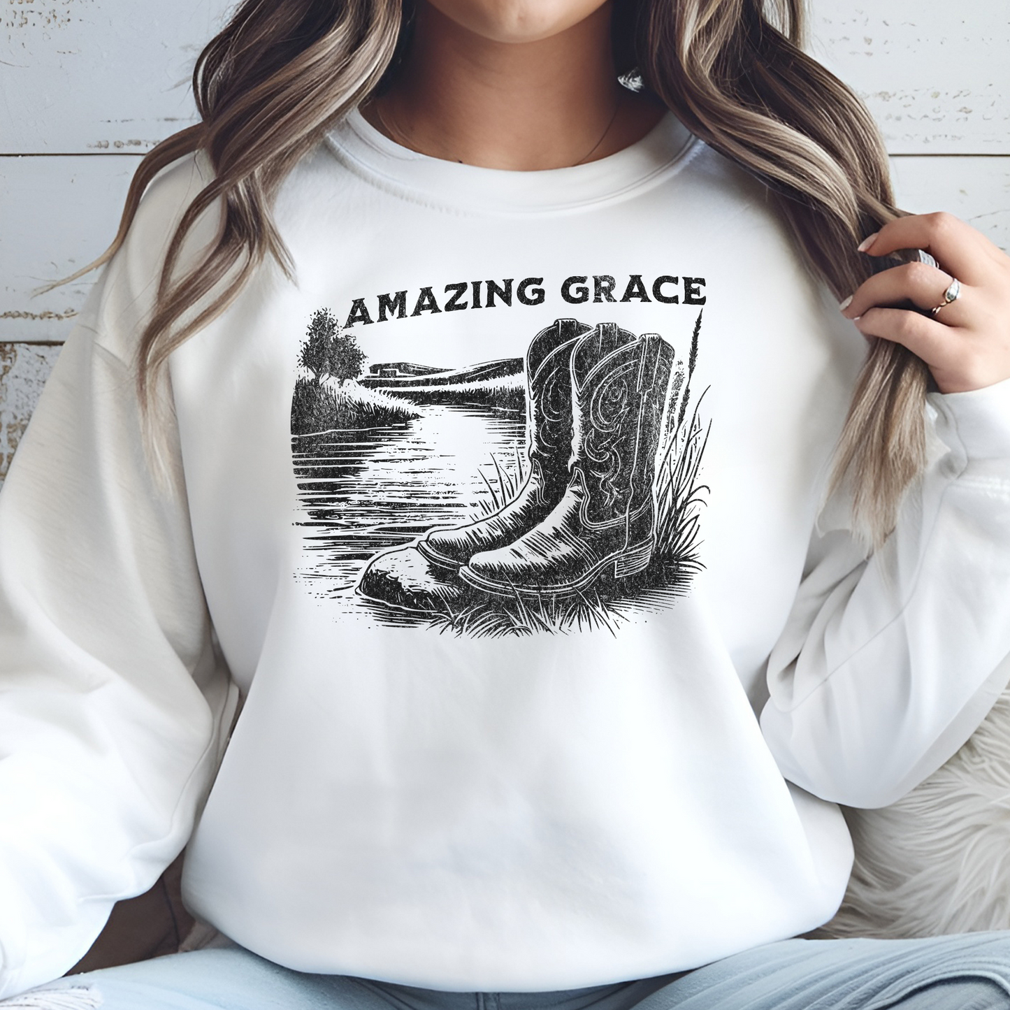 River Boots Amazing Grace digital design on a woman’s white sweatshirt