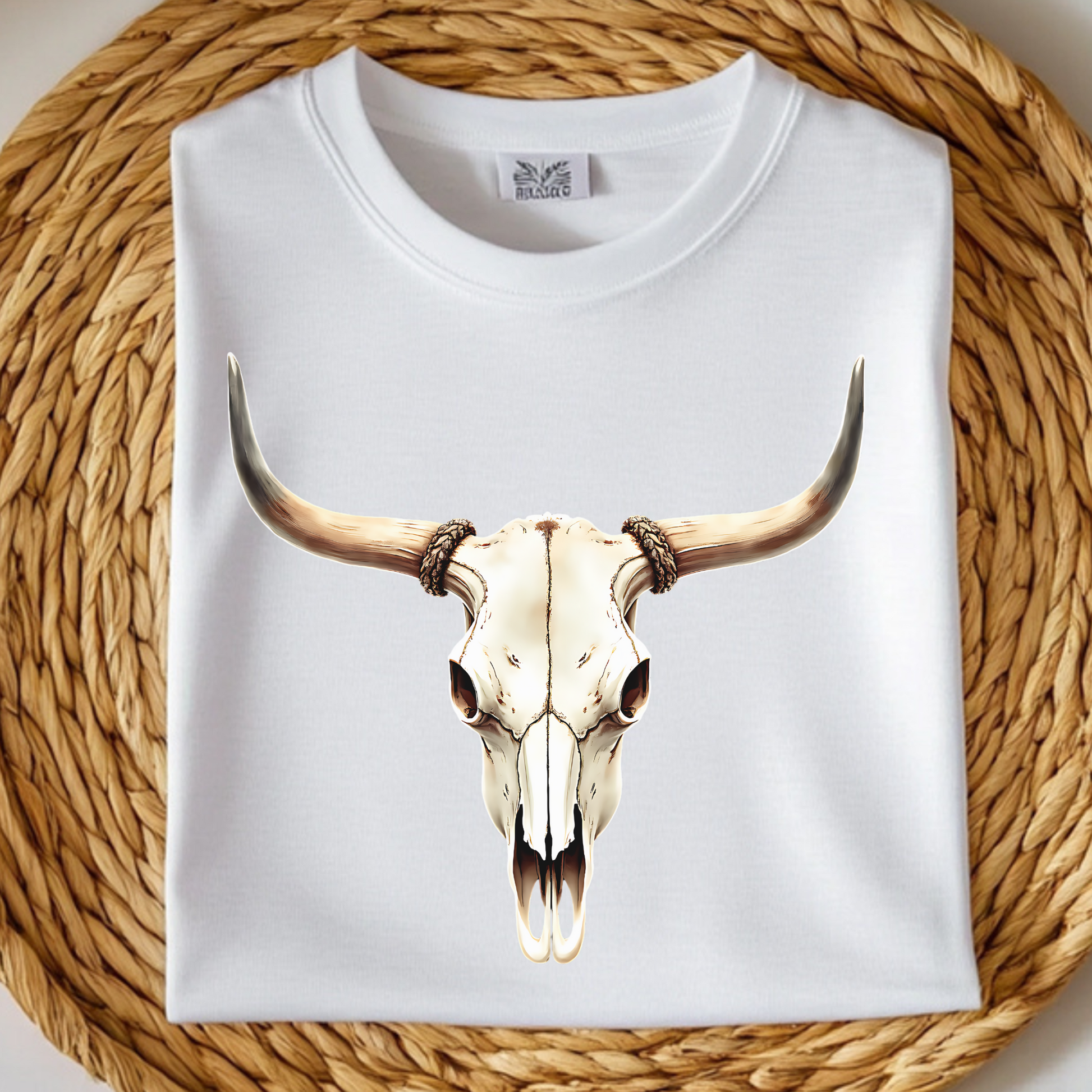 Bull Skull With Horns PNG digital design on a folded white t-shirt
