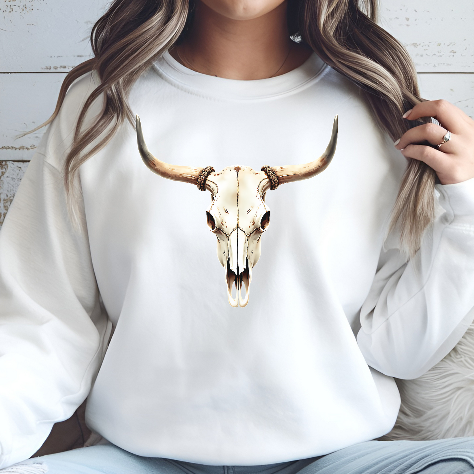 Bull Skull With Horns PNG digital design on a woman's white sweatshirt