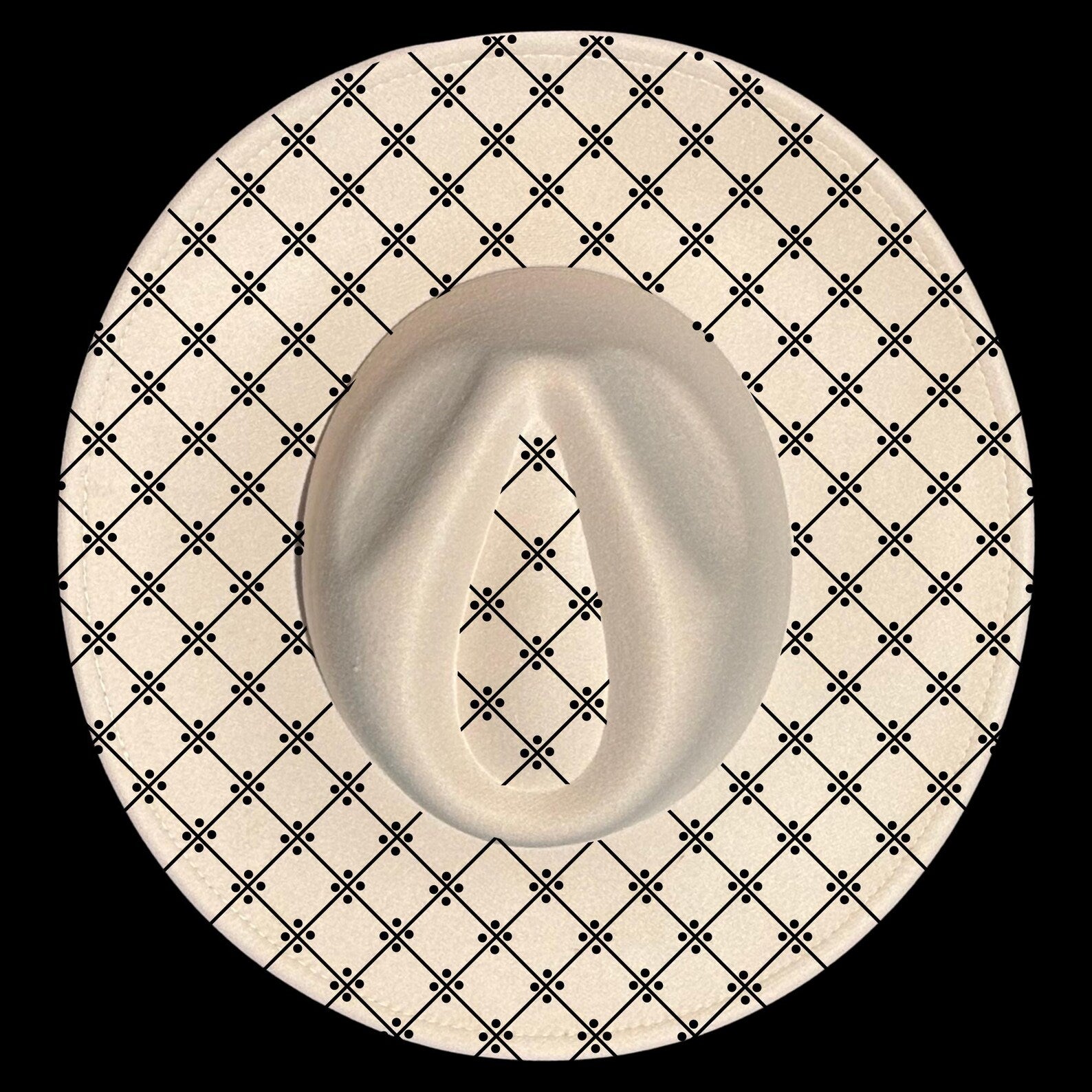 Wide brim hat with a black geometric pattern