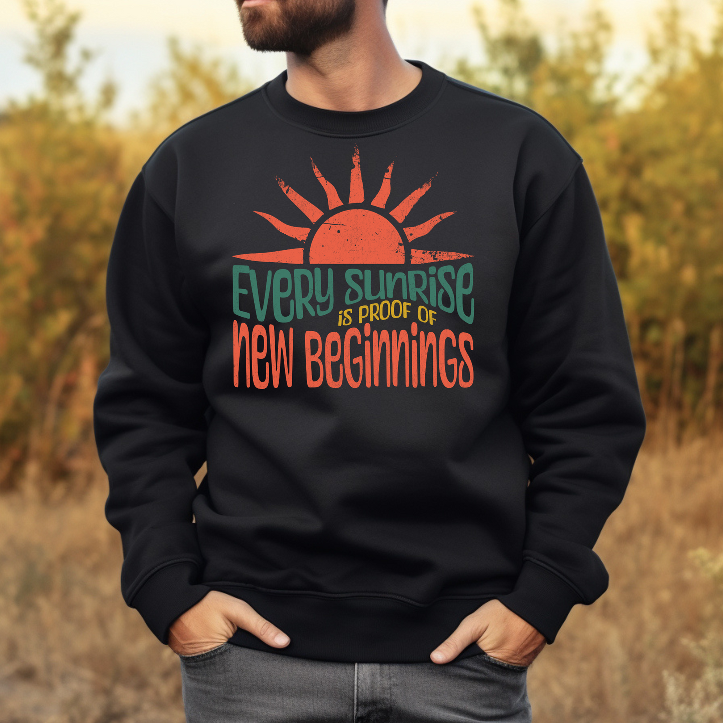 Every Sunrise Is Proof Of New Beginnings digital design on a man’s black sweatshirt