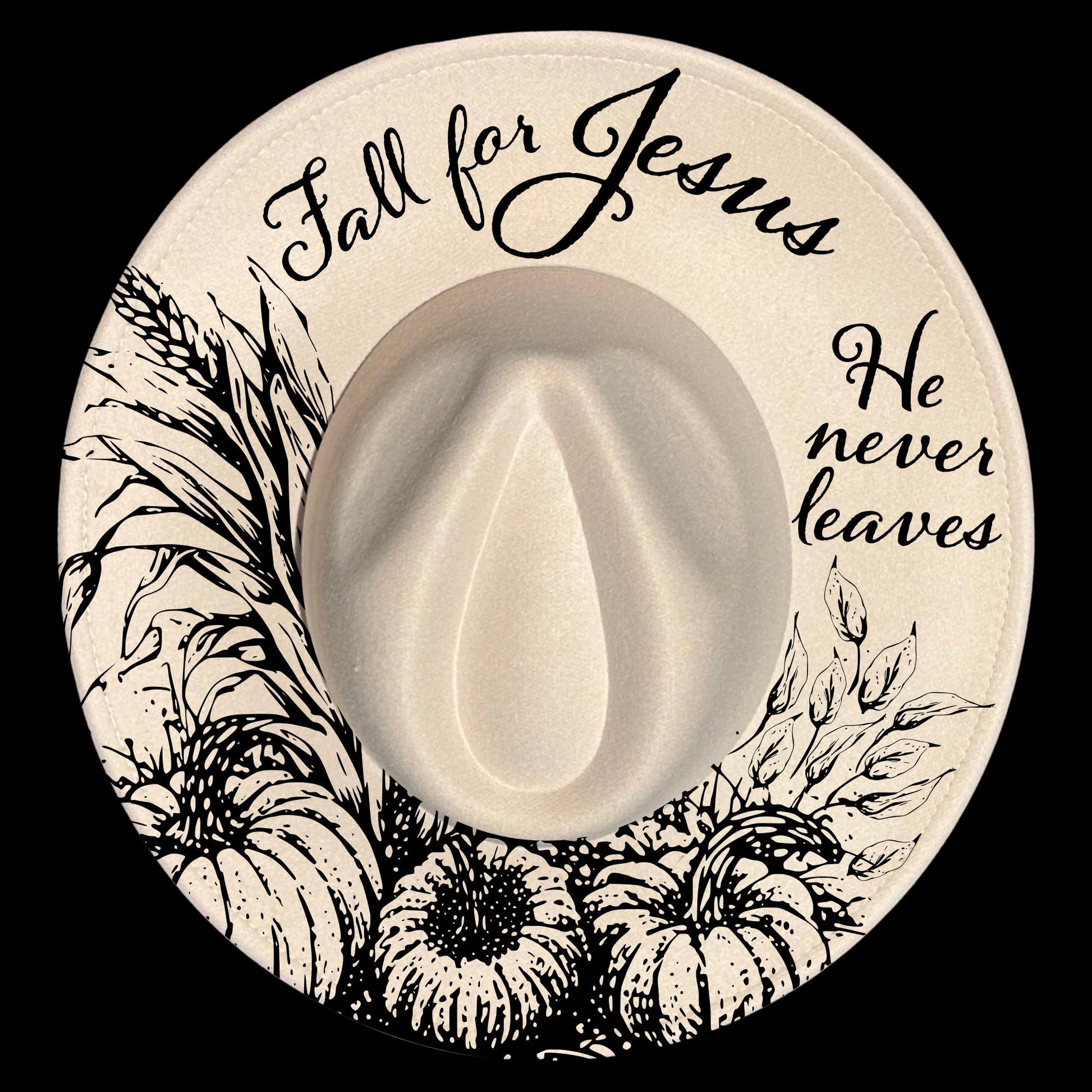 Circular design on a wide brim hat with 'Fall for Jesus' text, pumpkins, and leaves on a black background