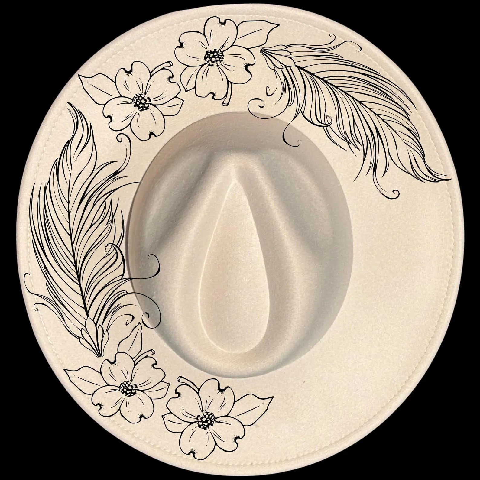 Feathers And Dogwood burned hat burning design on a wide brim hat.