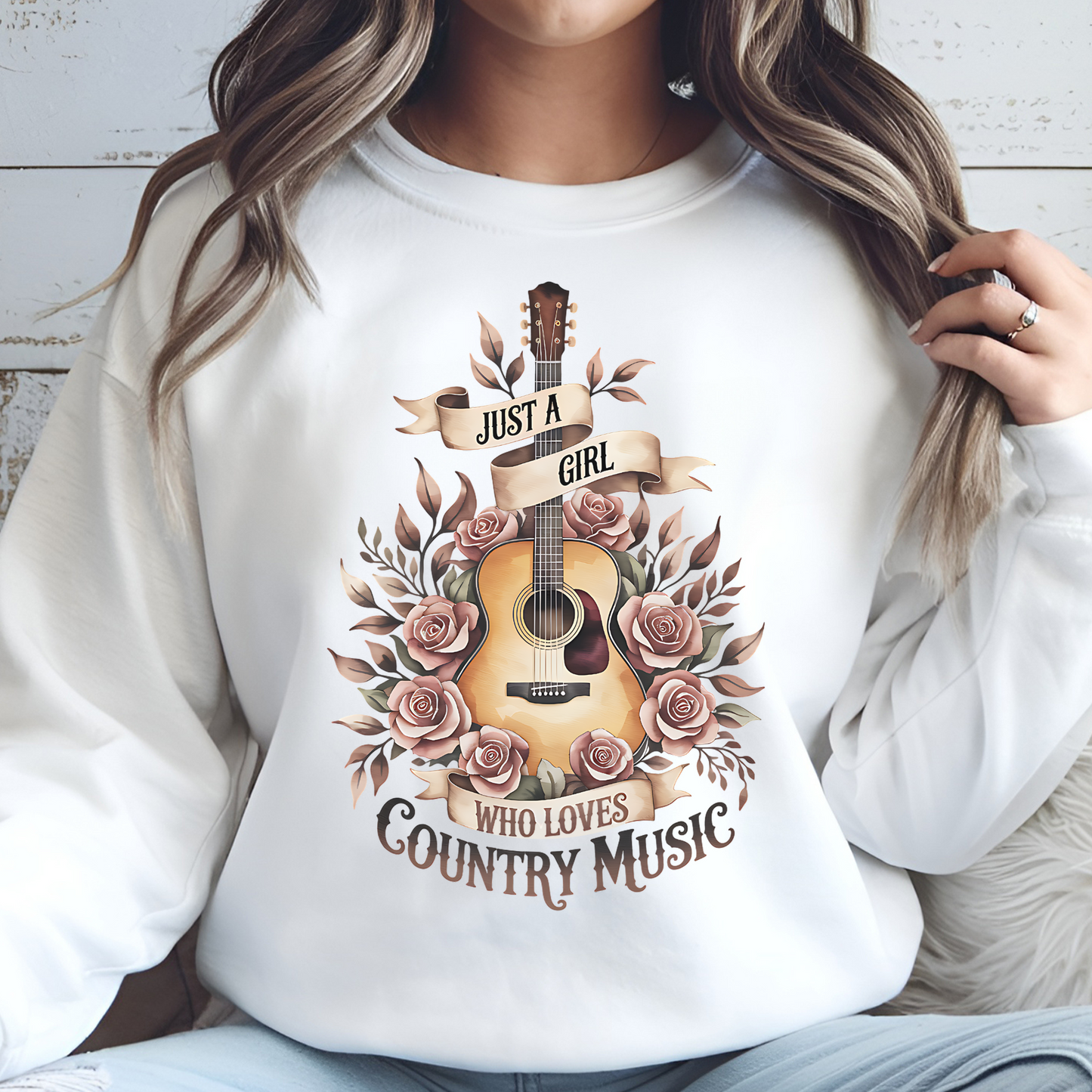 Just A Girl Who Loves Country Music PNG digital design on a woman's white sweatshirt.