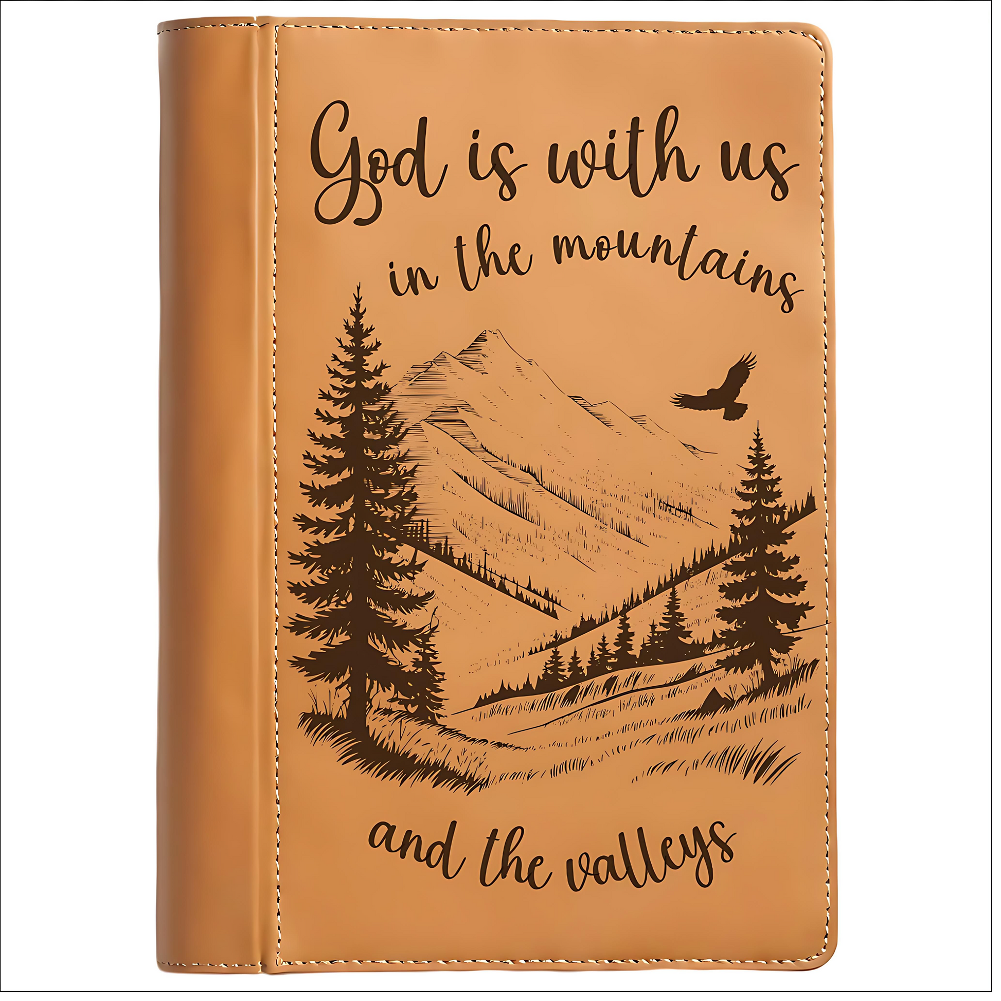 Brown leather journal cover with mountain and tree design and text on a white background