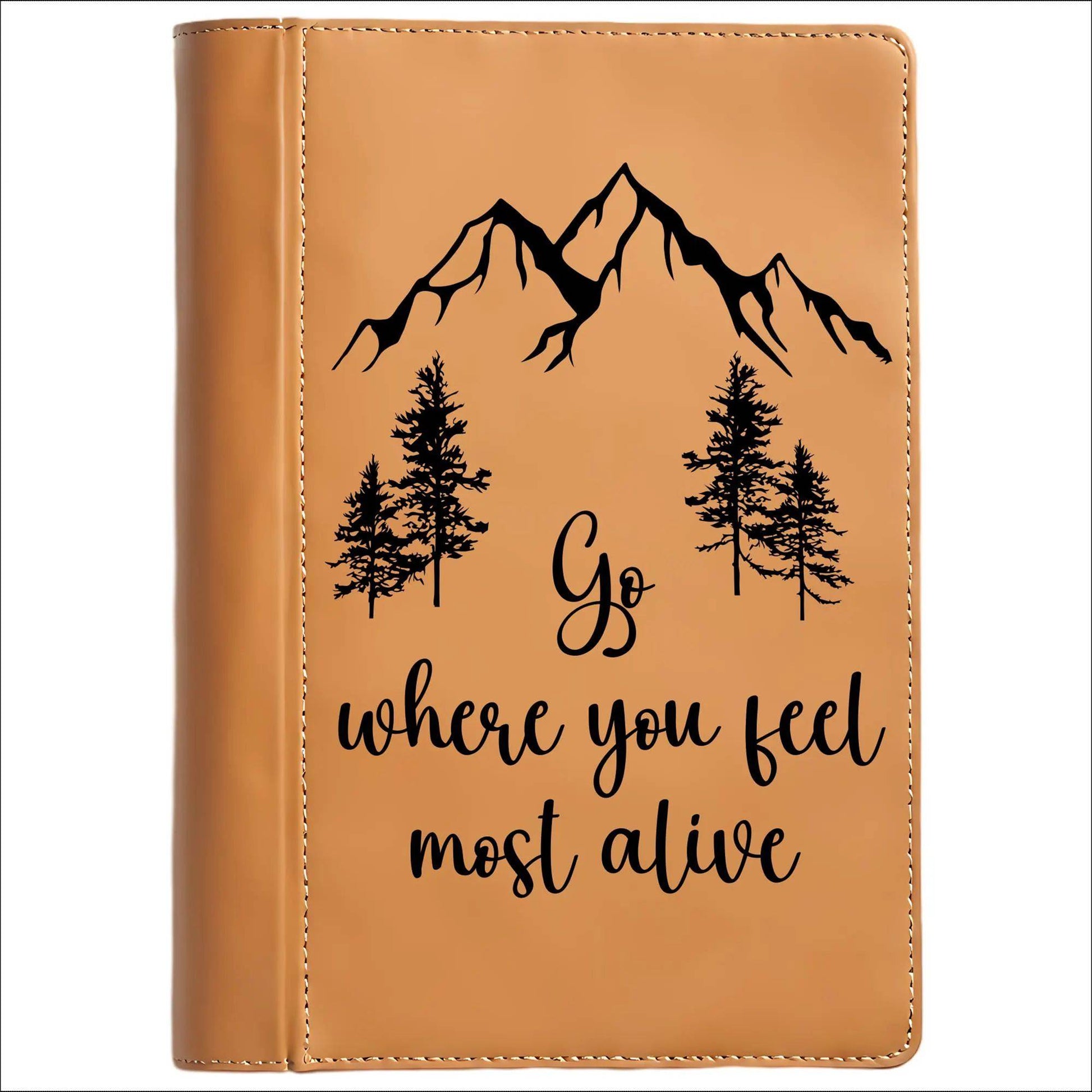 Brown leather journal with mountain and tree design and motivational quote on a white background
