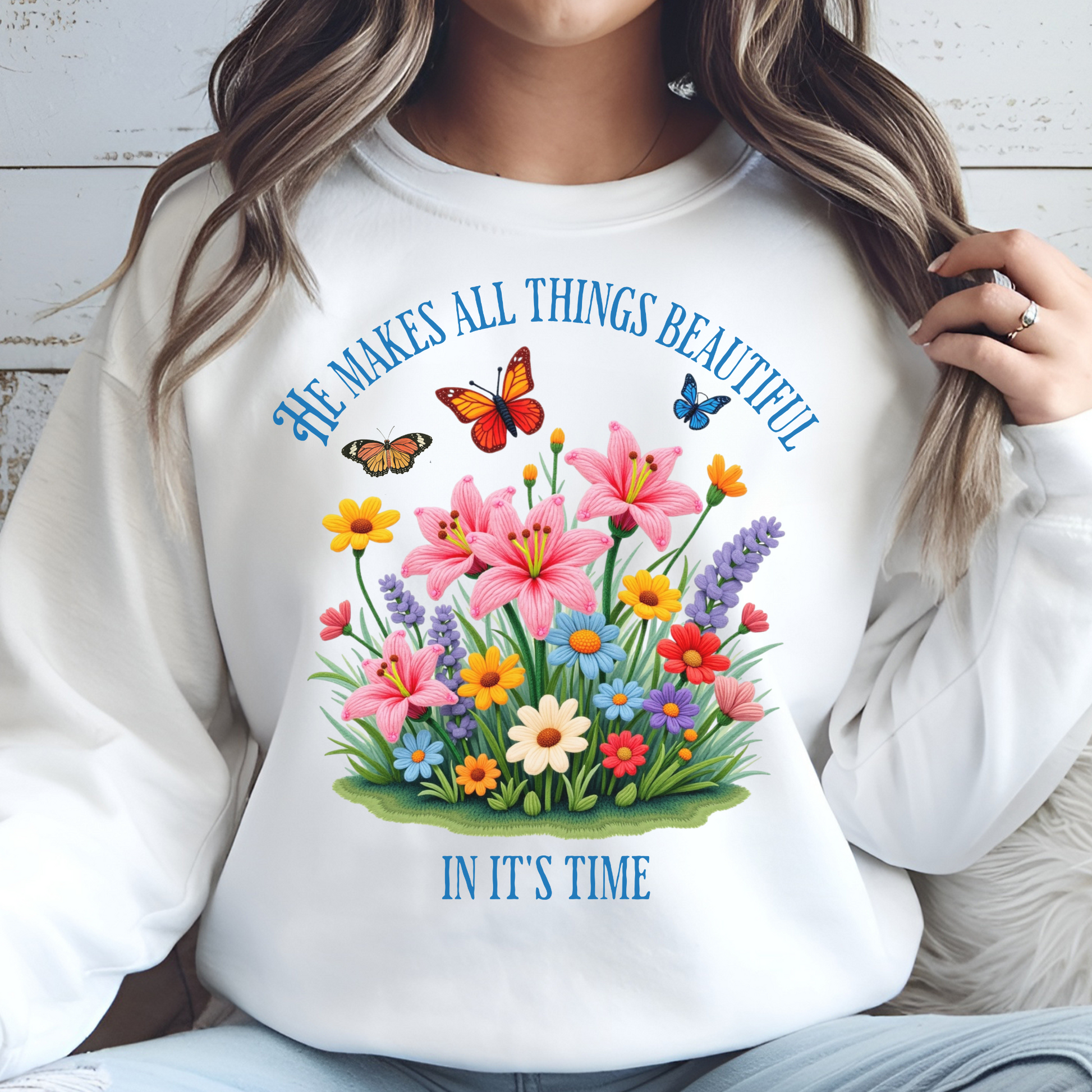 He Makes All Things Beautiful In It's Time floral design on a woman's white sweatshirt