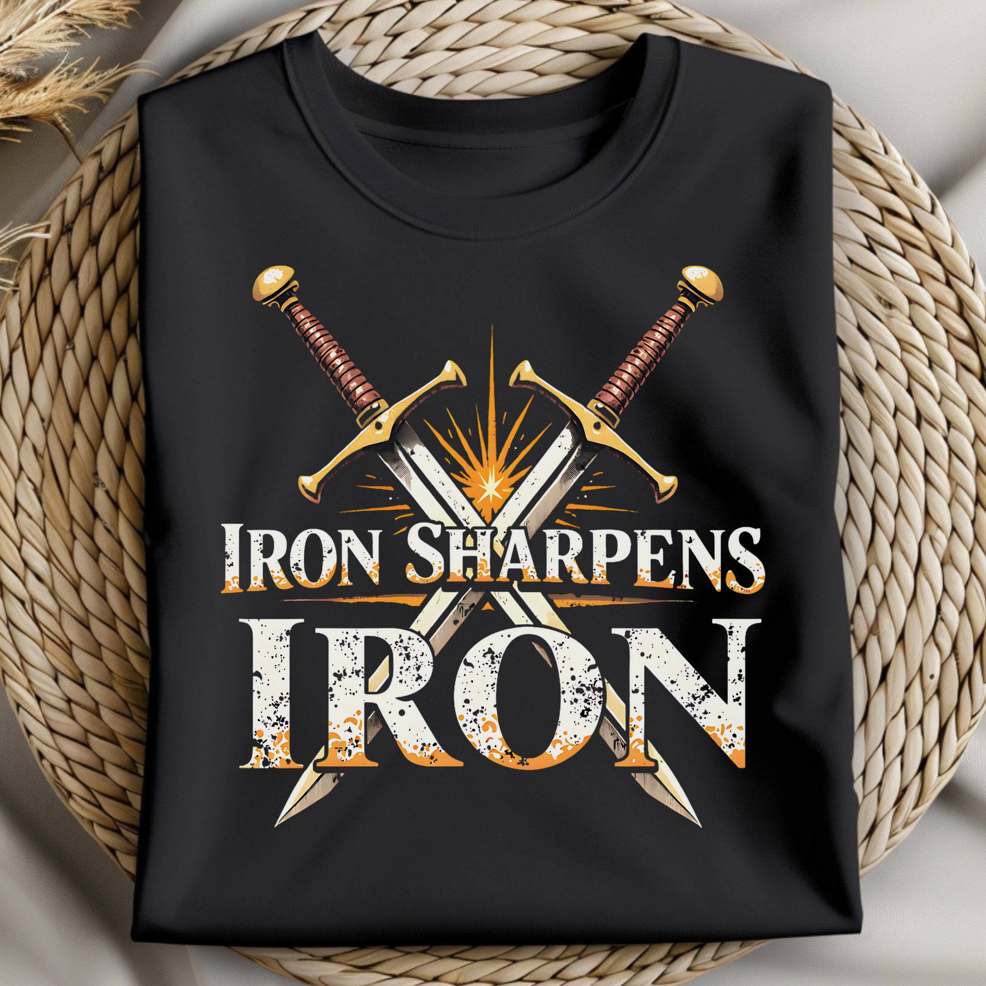 Iron Sharpens Iron Christian PNG digital design on a folded black t-shirt