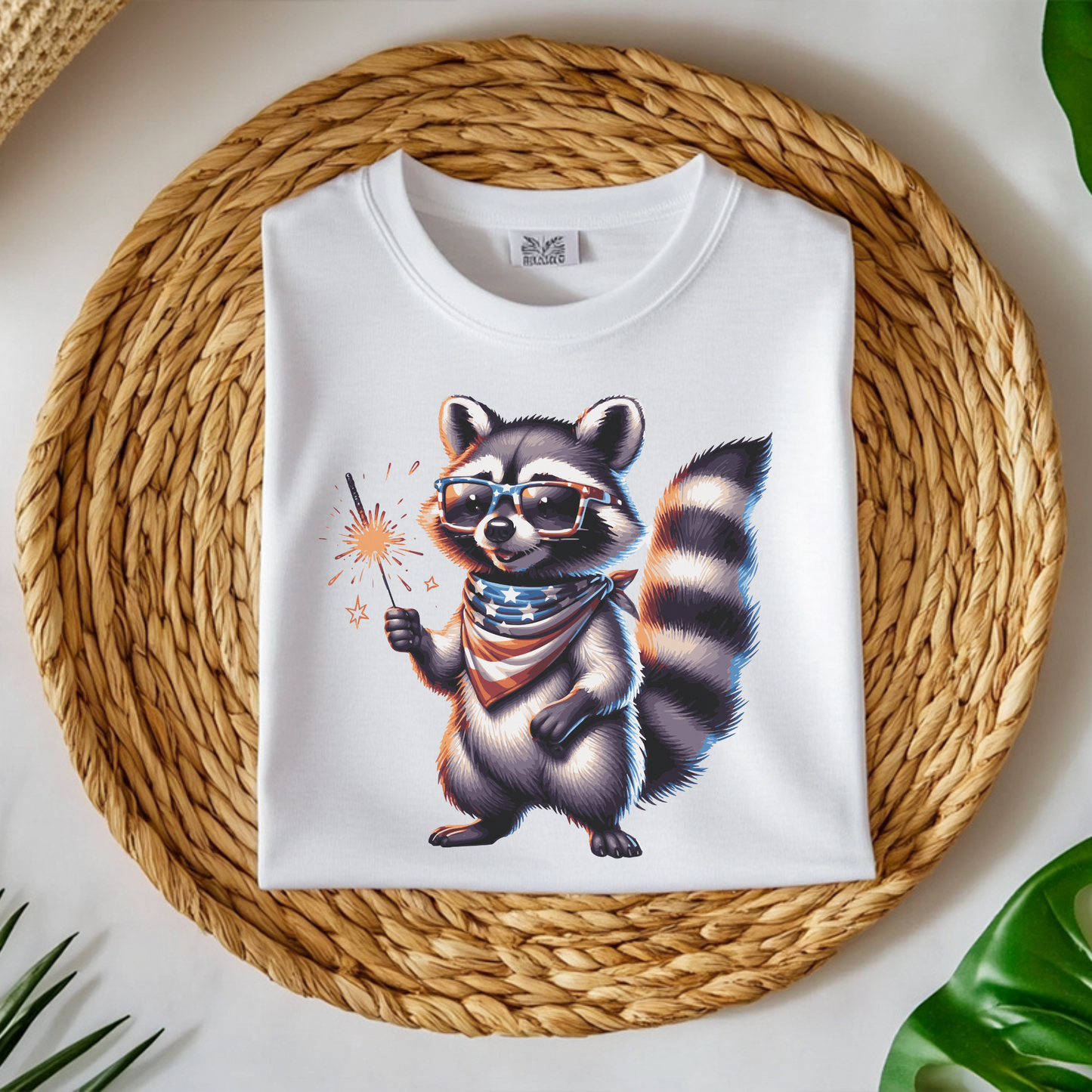 Independence Day 4th of July Raccoon Sparkler digital design on a folded t-shirt