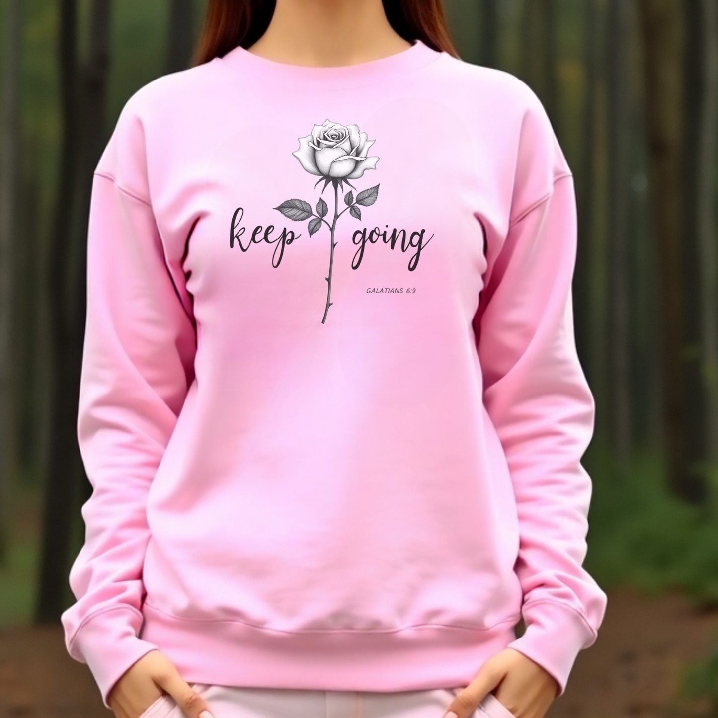 Keep Going long stem rose silhouette digital design on a pink sweatshirt
