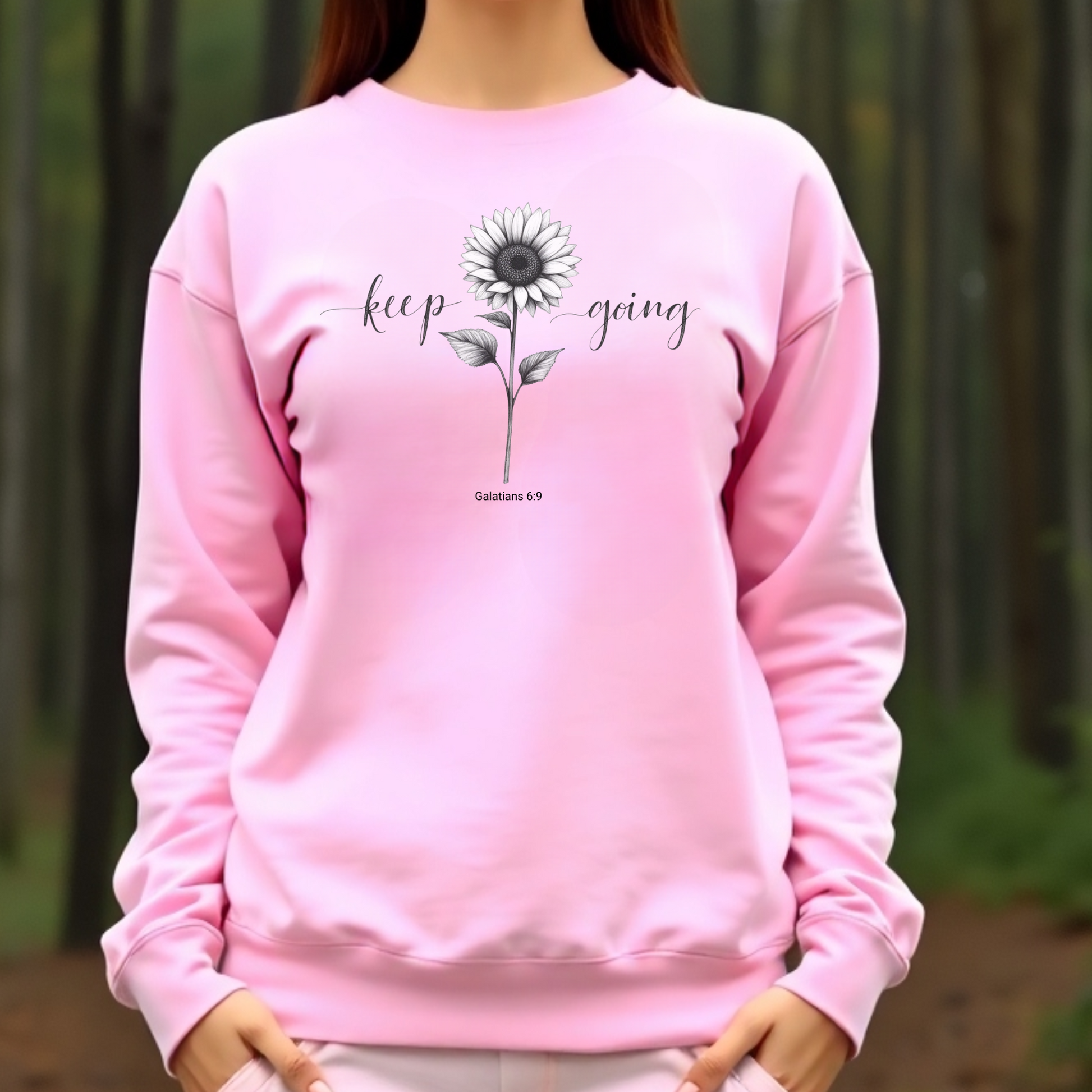 Keep Going Sunflower digital design on a pink sweatshirt
