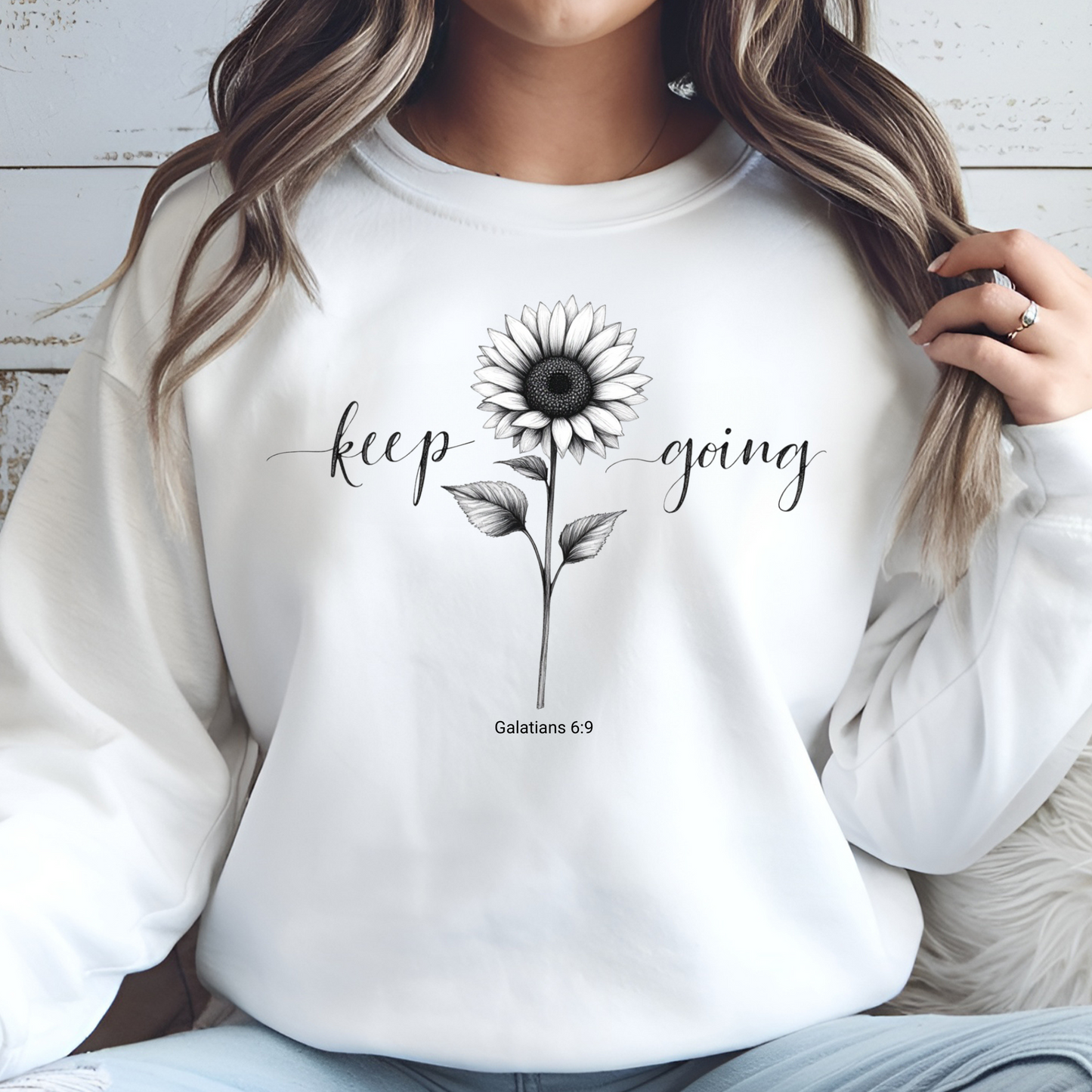 Keep Going Sunflower digital design on a white sweatshirt