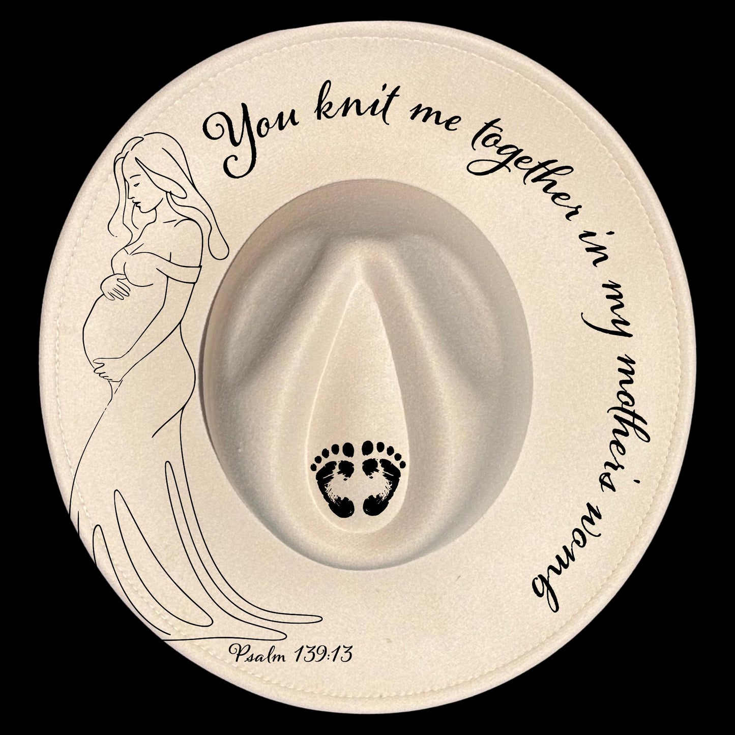Decorative hat burning design with a pregnant woman illustration, footprints, and "You knit me together in my mother's womb Psalm 139:13" text