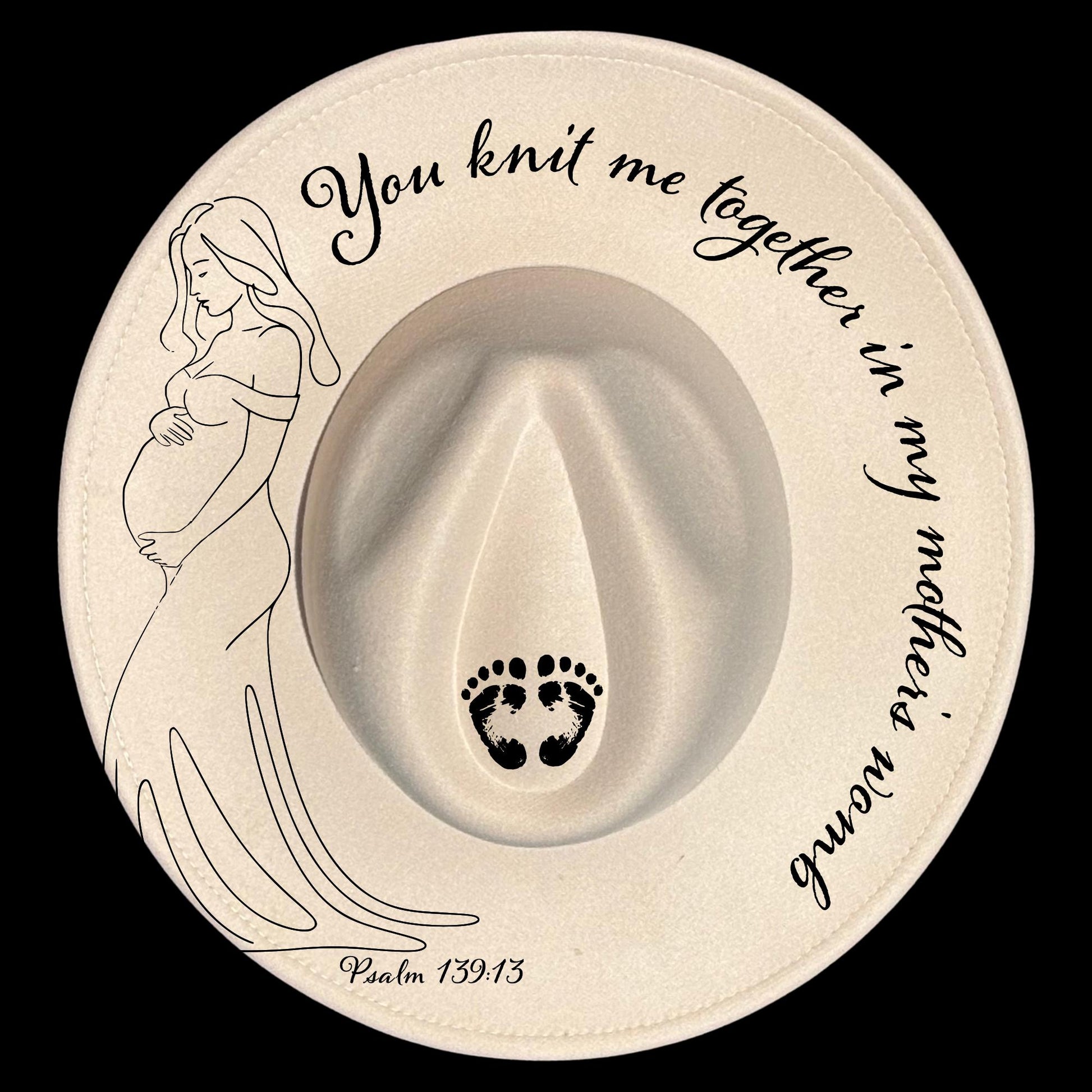 Decorative hat burning design with a pregnant woman illustration, footprints, and "You knit me together in my mother's womb Psalm 139:13" text