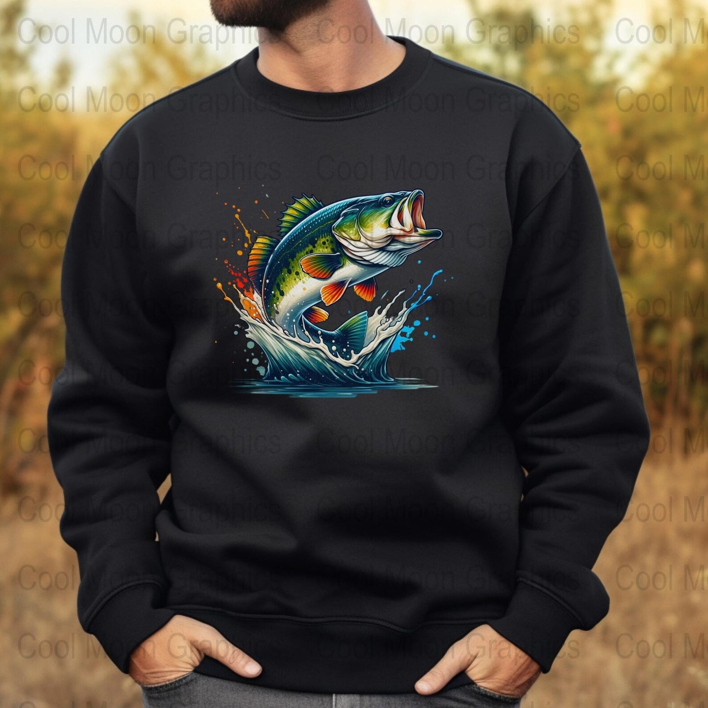 Black sweatshirt with a colorful largemouth bass graphic on a blurred nature background