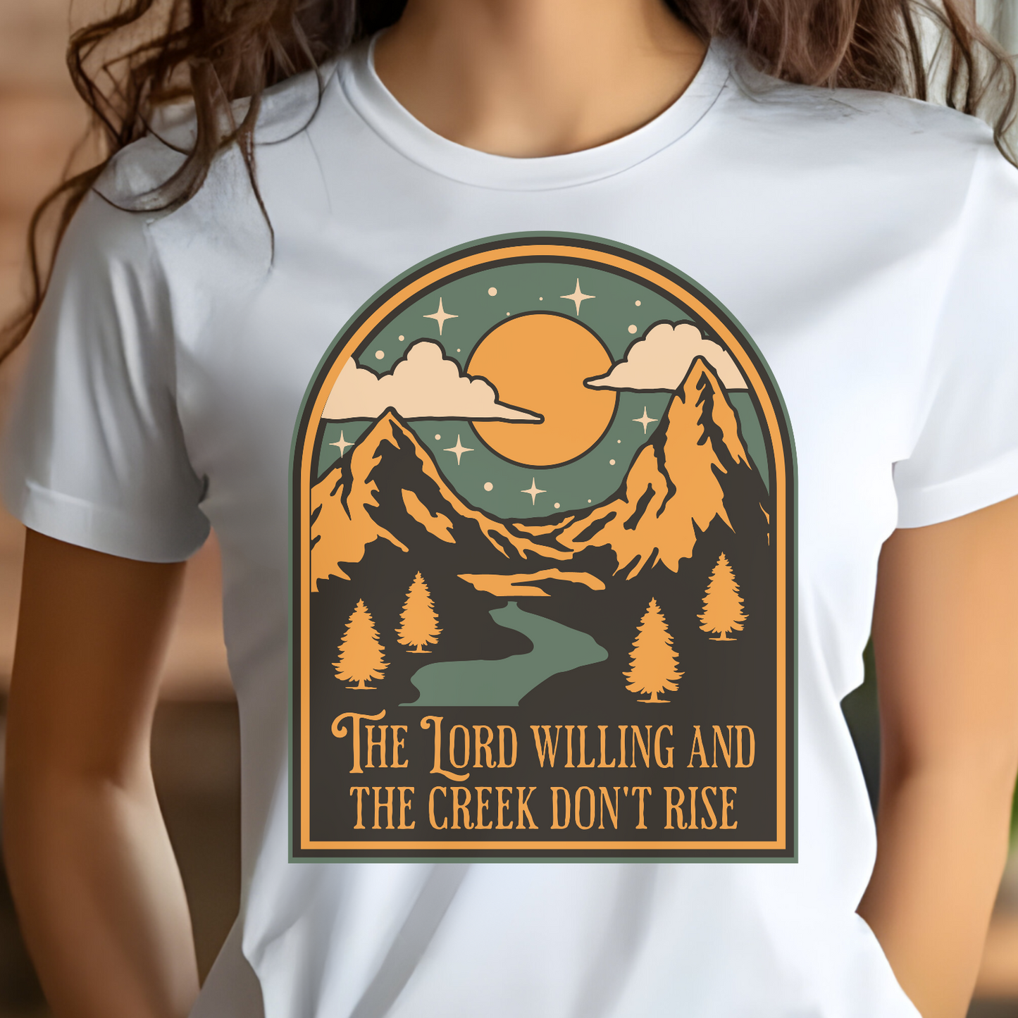 The Lord Willing And The Creek Don't Rise digital design on a woman's white t-shirt