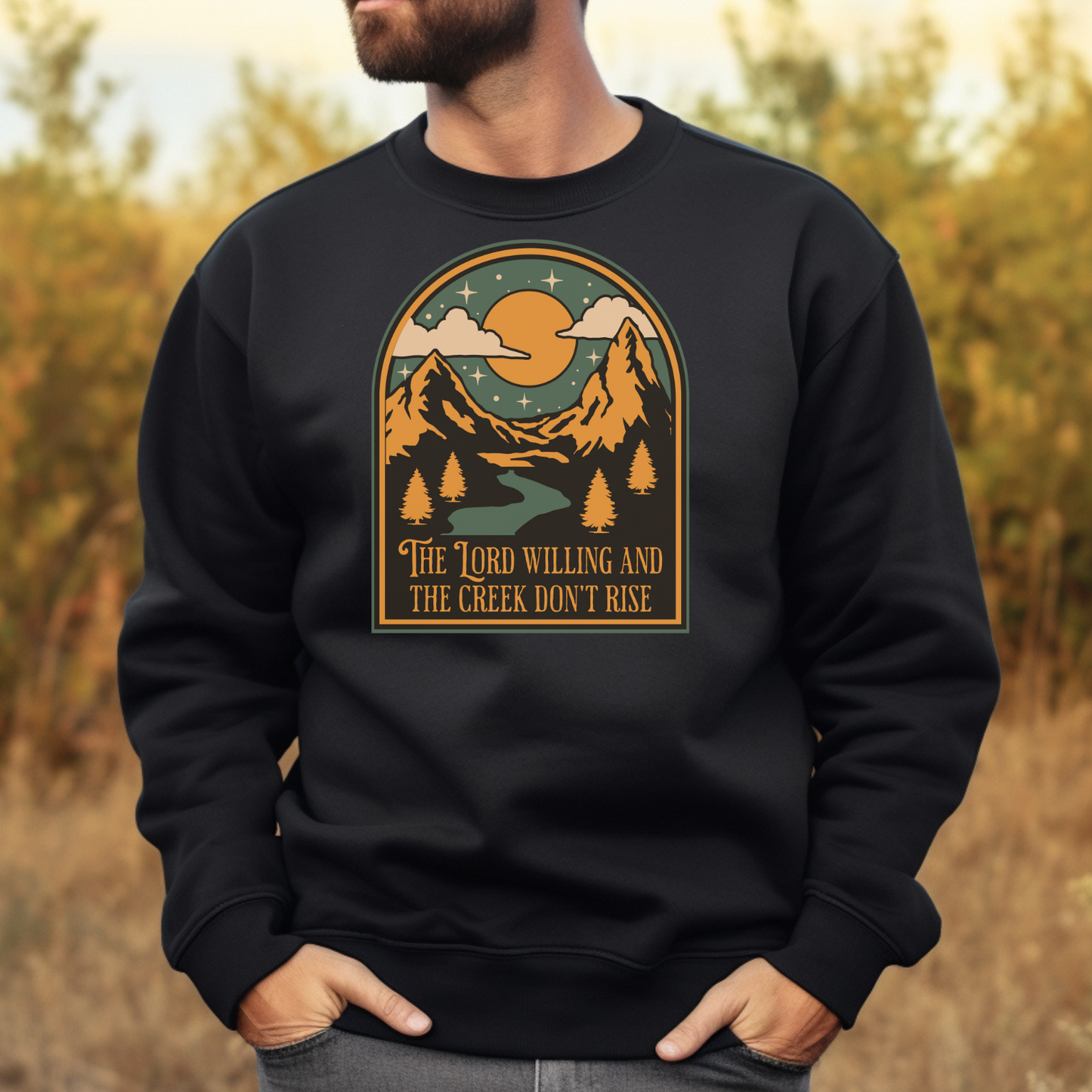 The Lord Willing And The Creek Don't Rise digital design on a man's black sweatshirt