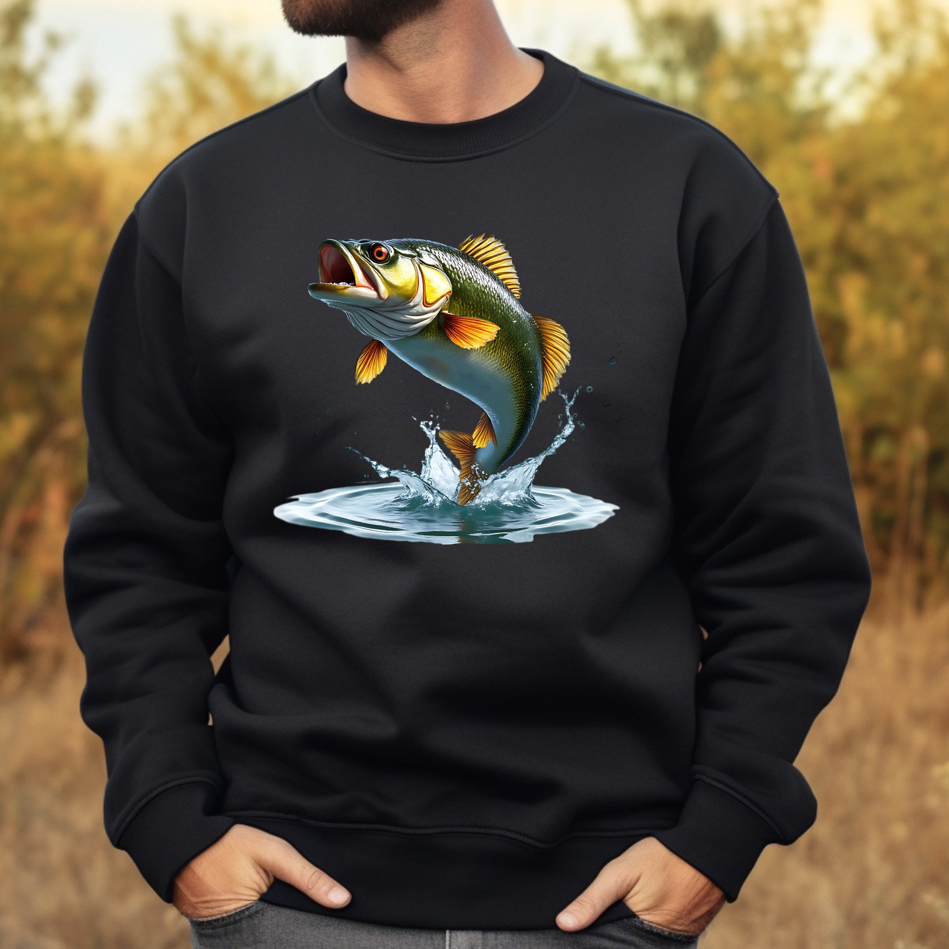Black sweatshirt with a fish graphic worn by a man, with a blurred natural background