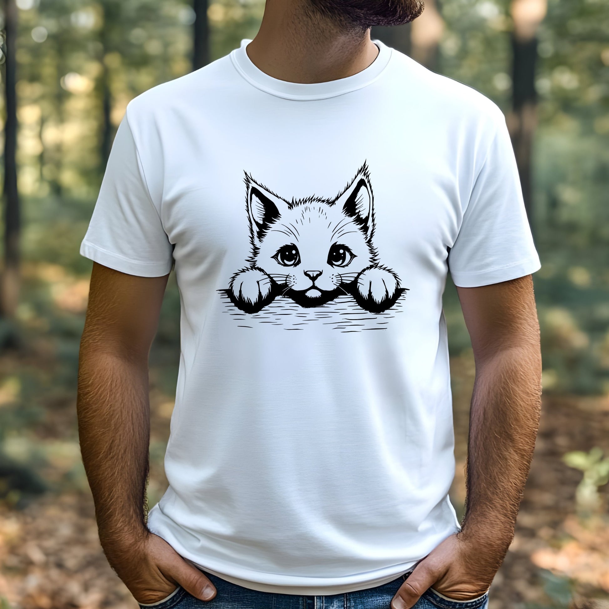 Person wearing a white t-shirt with a black and white cat graphic in a forest setting