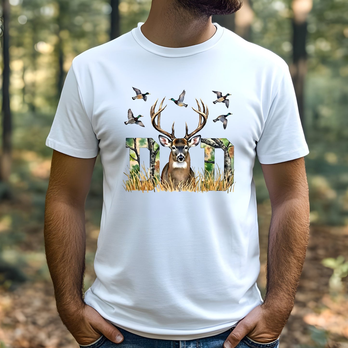 White t-shirt with a deer and birds design worn by a man in a forest setting