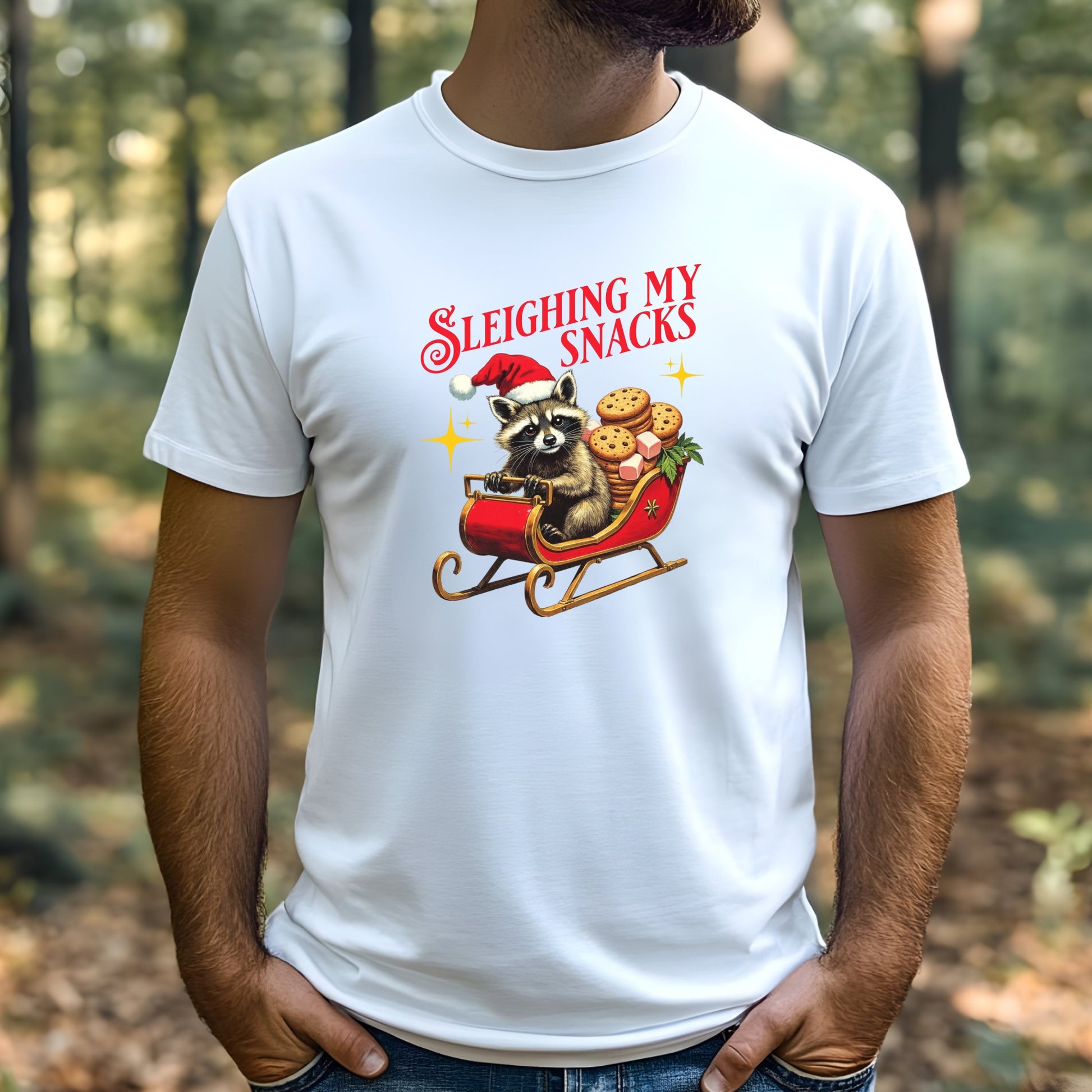 Man wearing a white t-shirt with a Christmas-themed graphic of a raccoon in a sleigh.