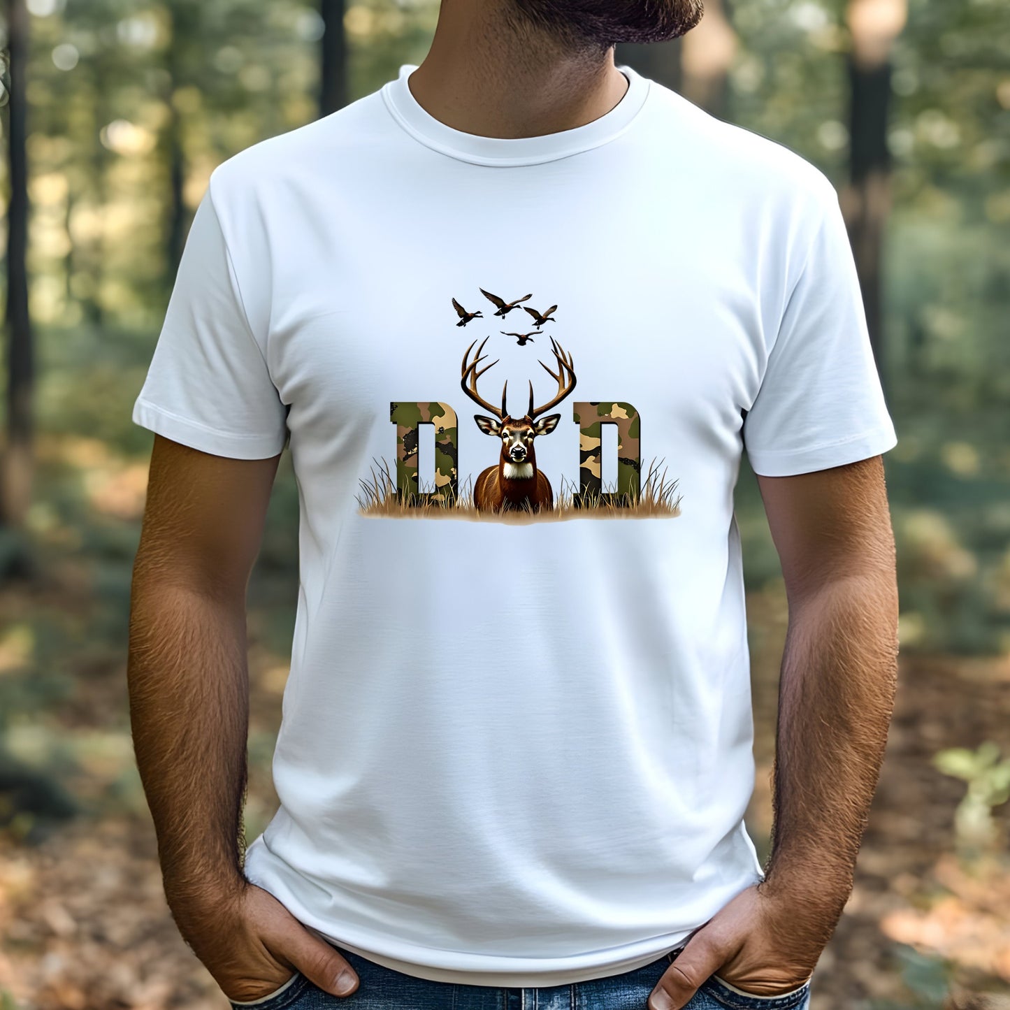 Man wearing a white t-shirt with a deer and 'Dad' graphic in a forest setting