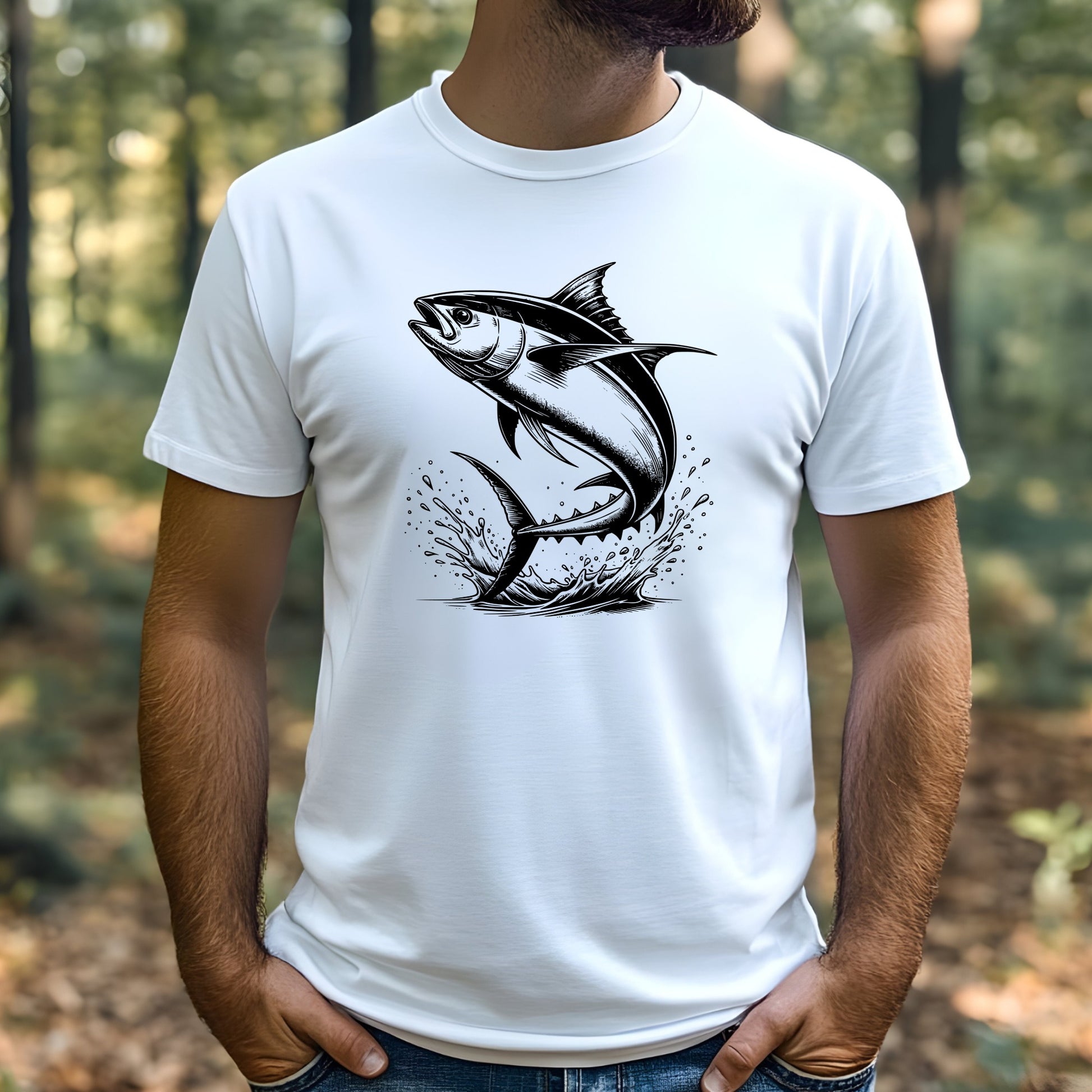 Man wearing a white t-shirt with a black tuna fish graphic design outdoors.