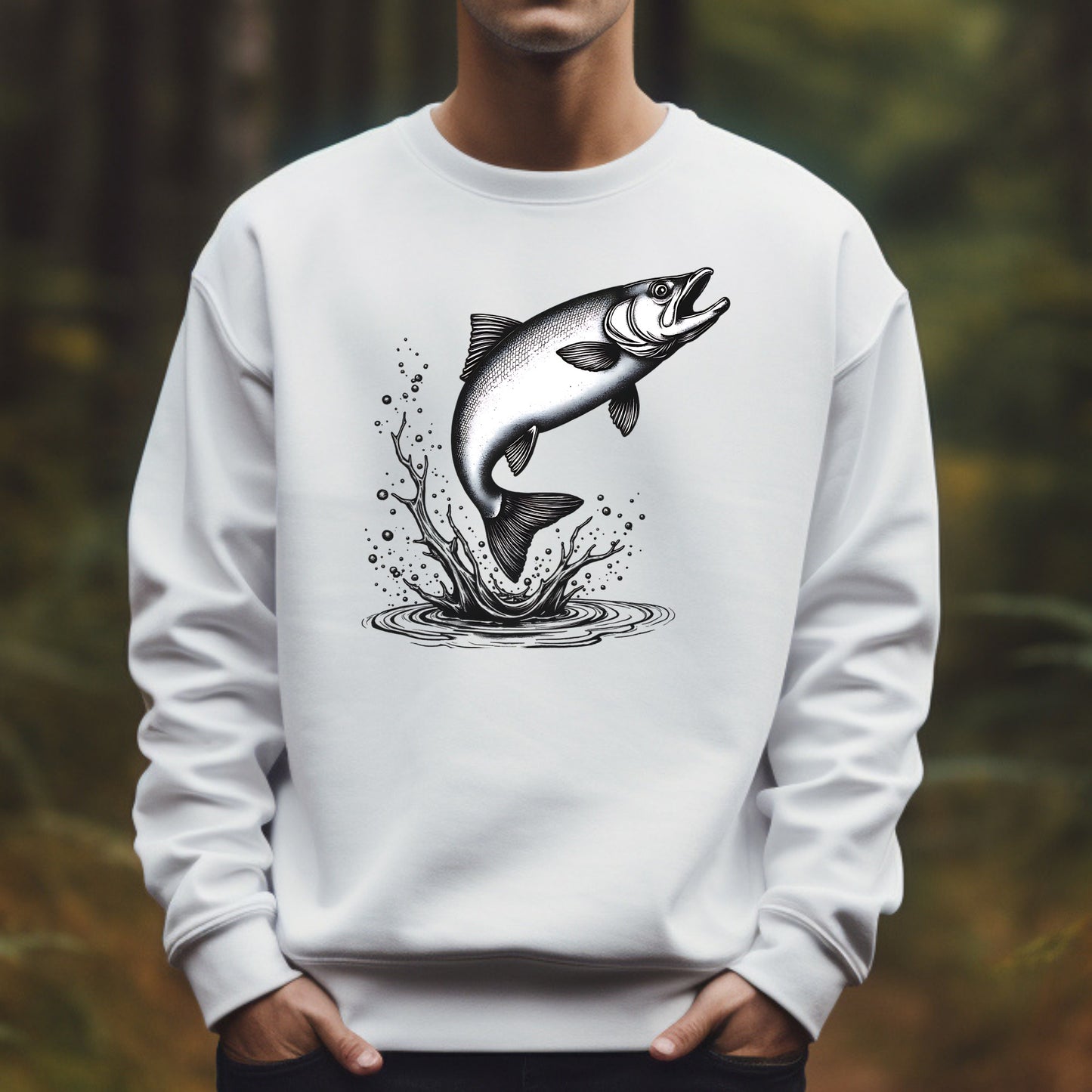 White sweatshirt with a salmon leaping graphic worn by a man in a forest setting