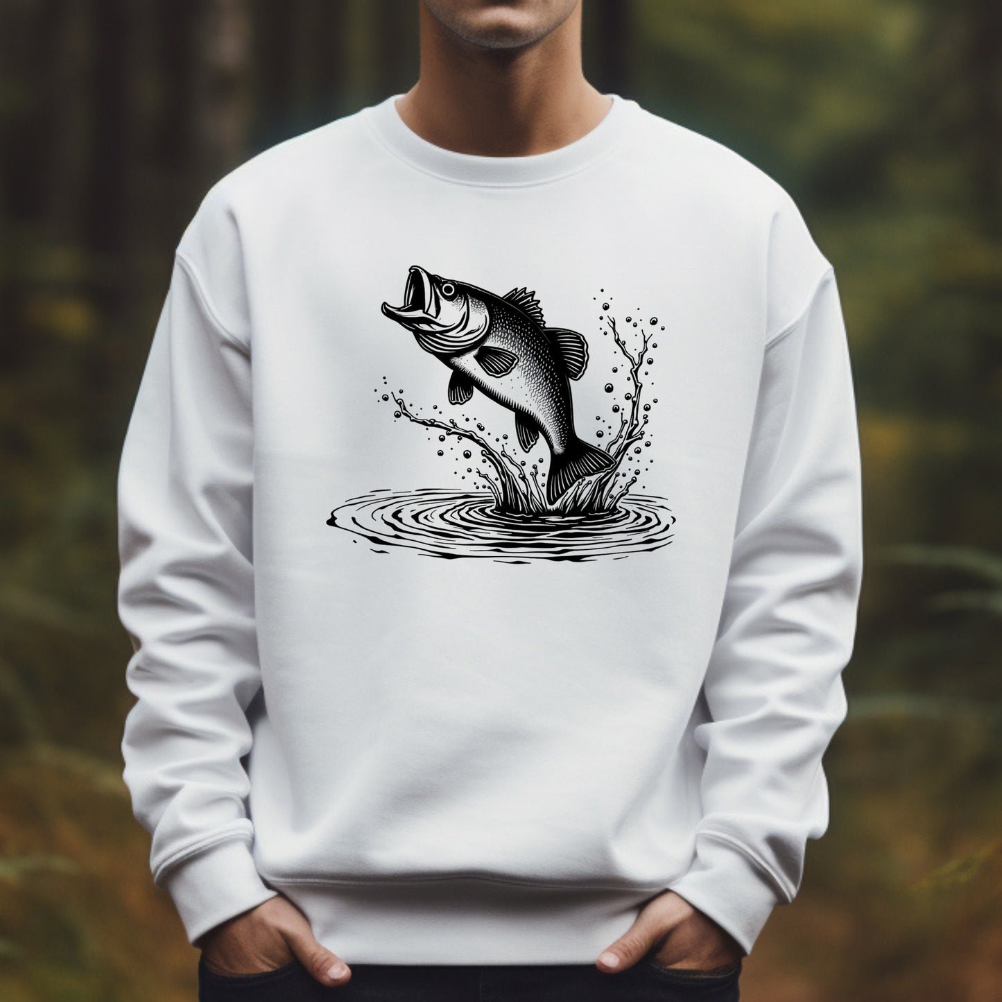 White sweatshirt with a black bigmouth bass fish graphic on a blurred natural background